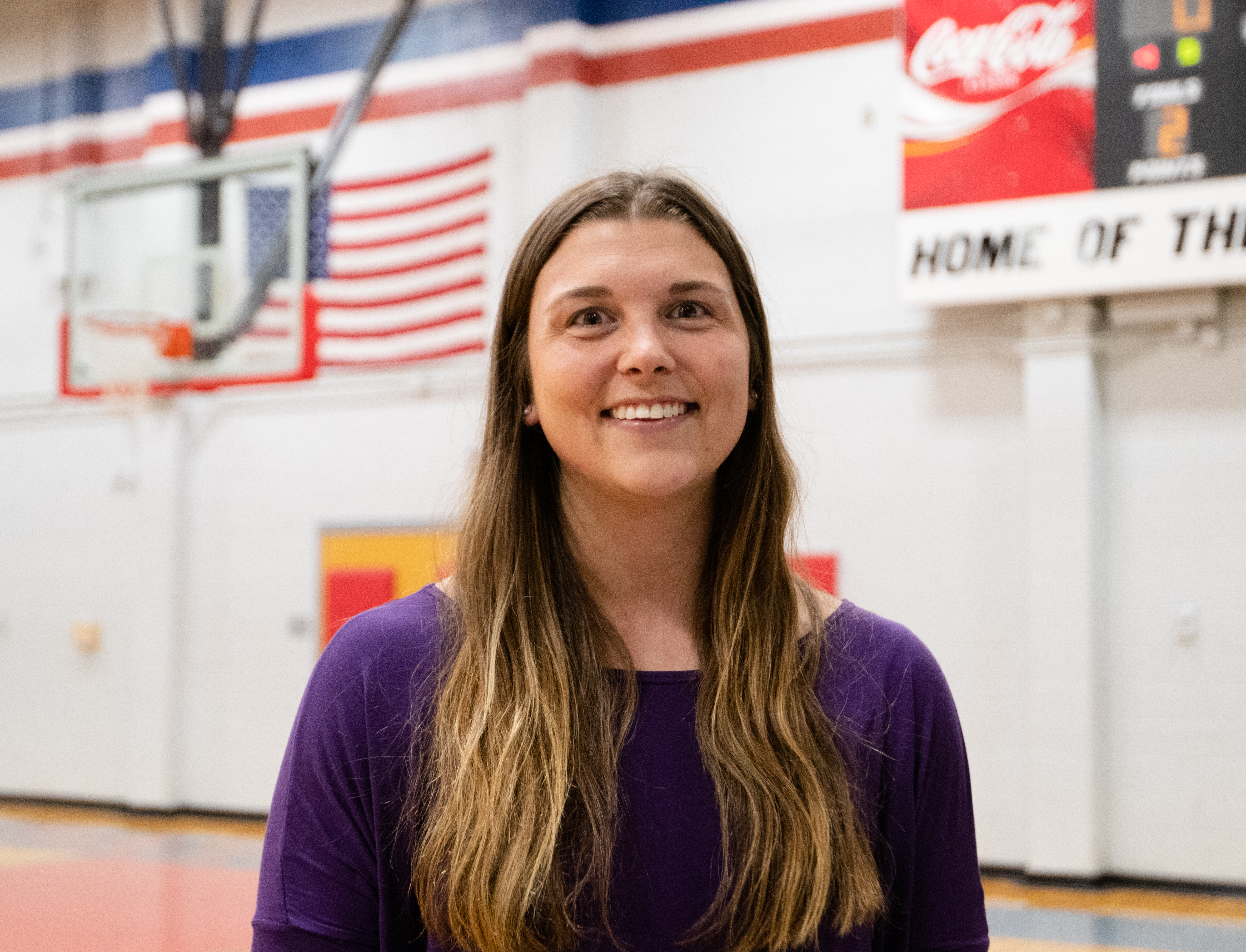Kate Shealy poses for a portrait in the Oglethorpe County High School gymnasium on Nov. 1, 2021. Shealy coaches the women's volleyball team at Oglethorpe High School. (Photo/Sarah White)