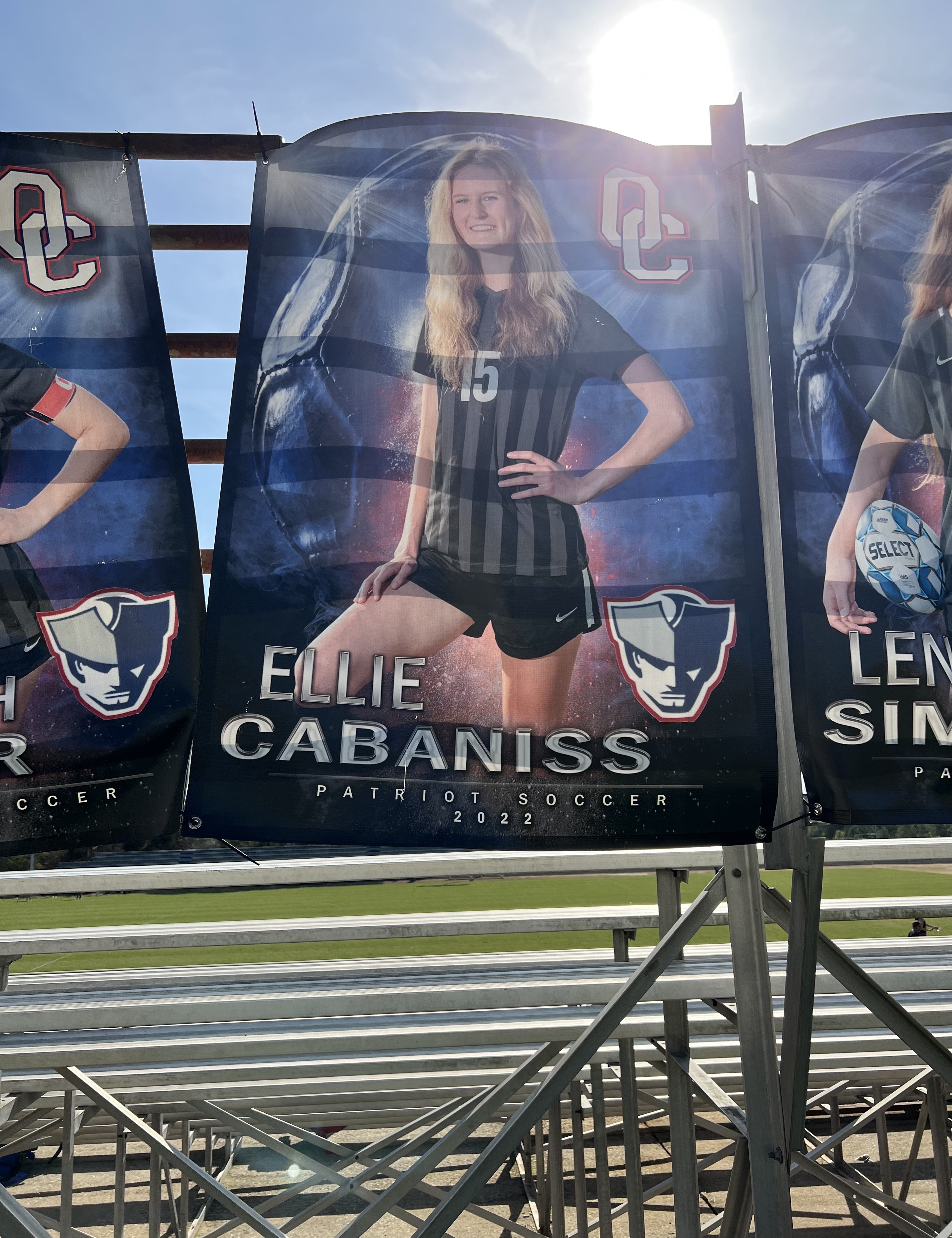 Ellie Cabaniss' senior banner is attached to the back of the bleachers at OCHS stadium. She has been home schooled, but is taking one class at OCHS while also dual enrolled at UGA. Submitted photo