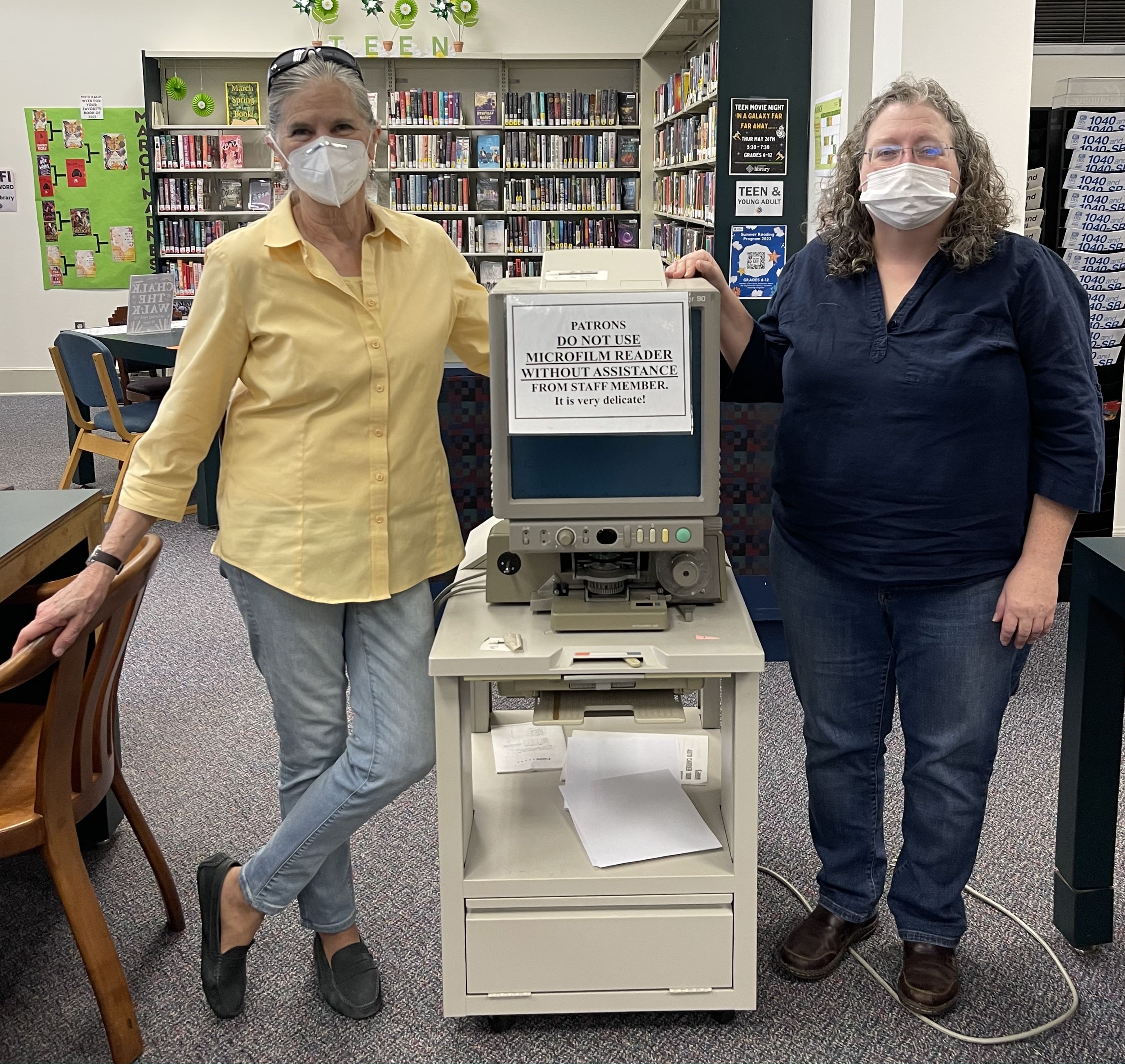 Jean Westmacott and Amanda Chapman stand next to the old microfilm reader in the  Oglethorpe County Library that needs to be replaced because it no longer works. (Submitted Photo)