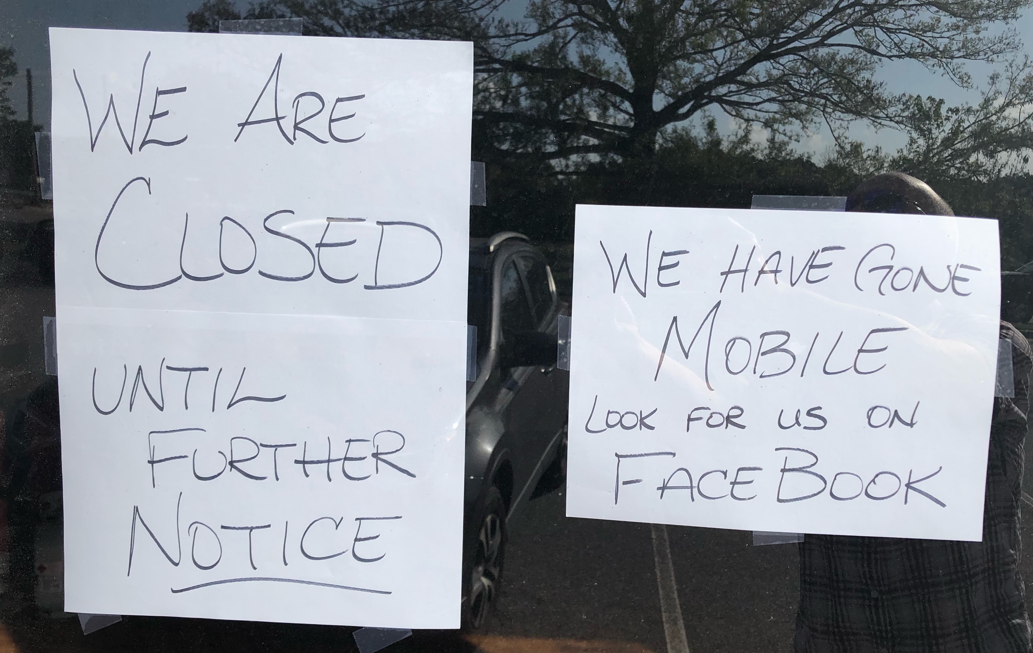 Signs on the door of Trava’s Dog Gone Good Cafe states that it’s closed. (Photo/Andy Johnston) 