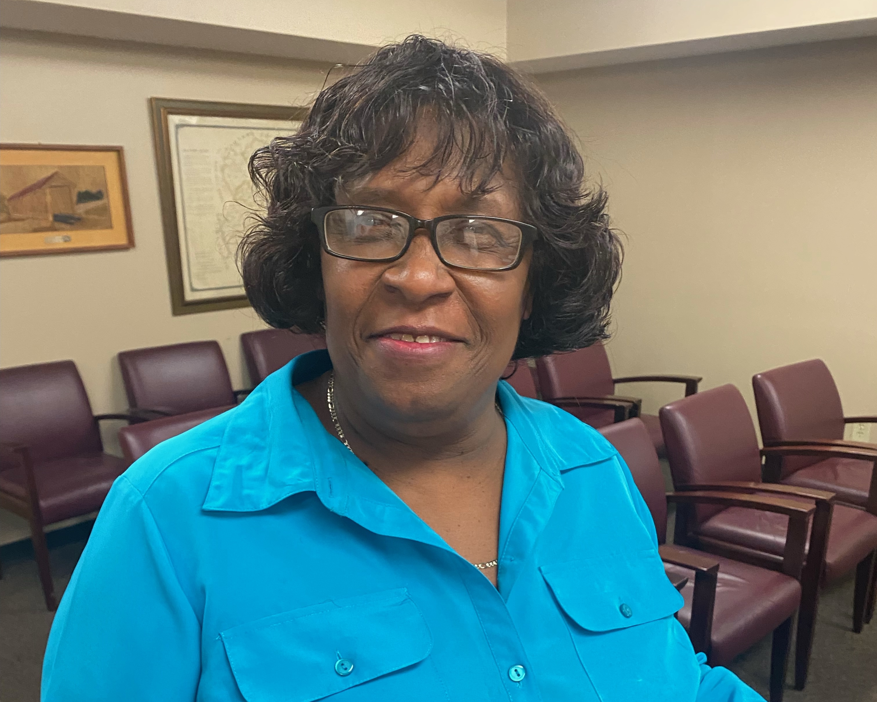 Hattie Collins has worked for the county for 14 years and is often the first person folks see when they come to the commission’s office. (Photo/Dink NeSmith)