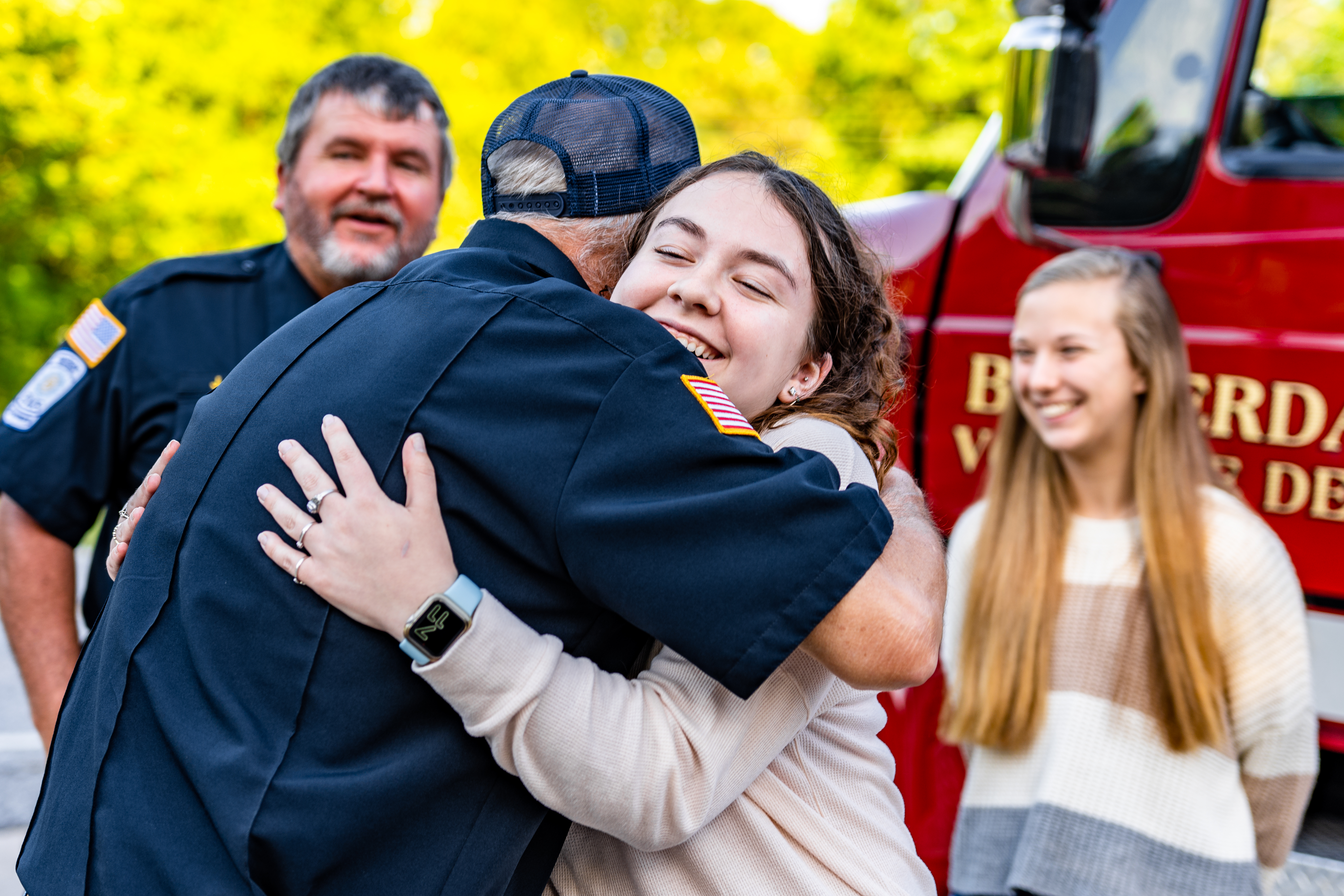 OCHS senior Elisse Griffiths hugs Carl Young, the Chief of Oglethorpe County Fire and Rescue after the Beaverdam Volunteer Fire Department gave $2,000 to help fund HOSA’s trip to the international competition. (Photo/Jack Casey)