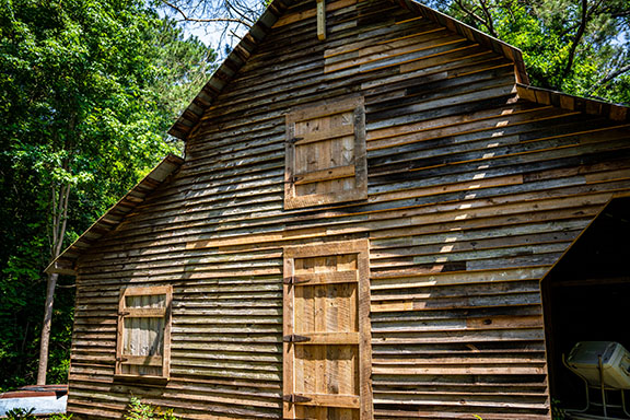 Donna Wetterlund has raised $6,500 of the estimated $20,000 it will take to finish restoring the barn on her daughter's property on Elberton Road. (Photo/Jack Casey)