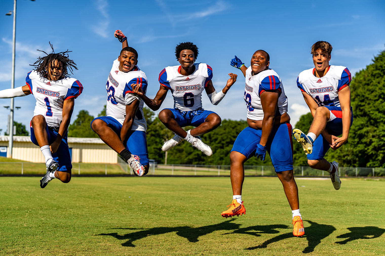 Oglethorpe County football players Jordan Johnson (1), Jayland Richardson (30), Darius Heard (6), K.B. Bonds (58) and Ashton Sexton (14) appear to be jumping for joy for the start of the 2022 high school football season. The Patriots open at home against East Jackson at 7:30 p.m. Friday. (Photo/Jack Casey)