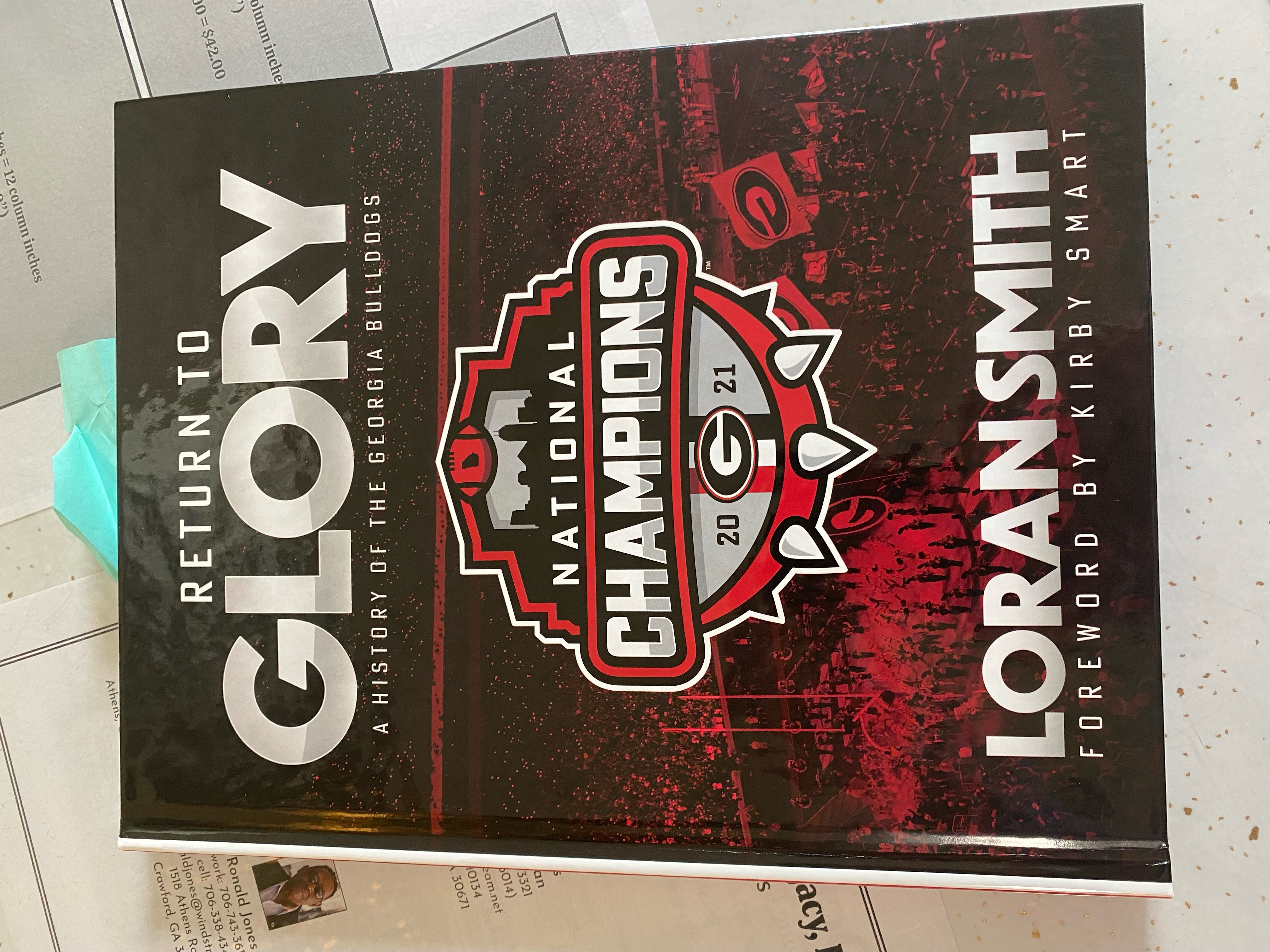 (Dink NeSmith/The Oglethorpe Echo) Loran Smith’s latest book, titled “Return to GLORY: A History of the Georgia Bulldogs,” includes the 2021 national title season.