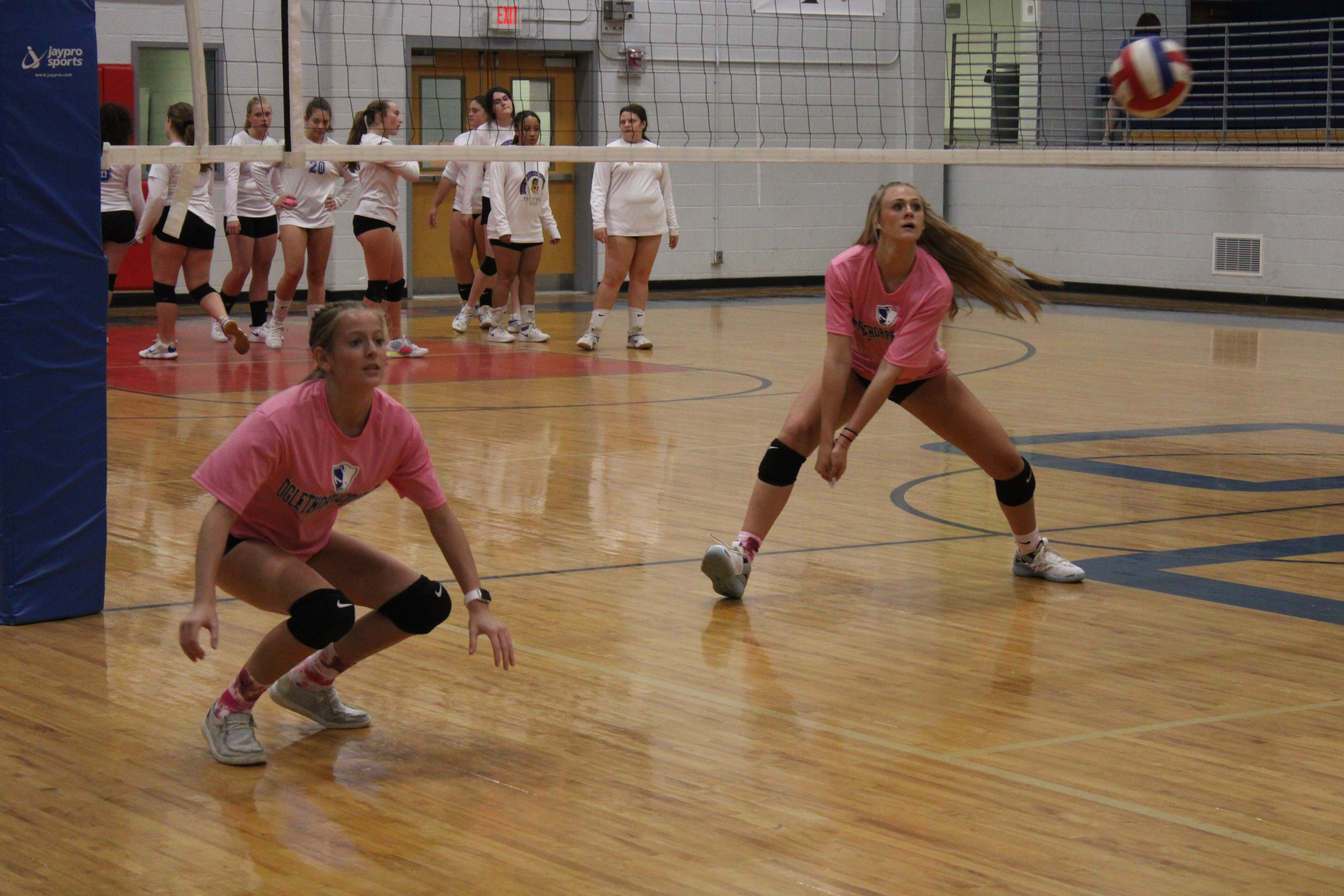 Weslynn Thurmond (left) and Madi Kelley warm up before their game against Lake Oconee Academy on September 15. (Photo/De Turner)