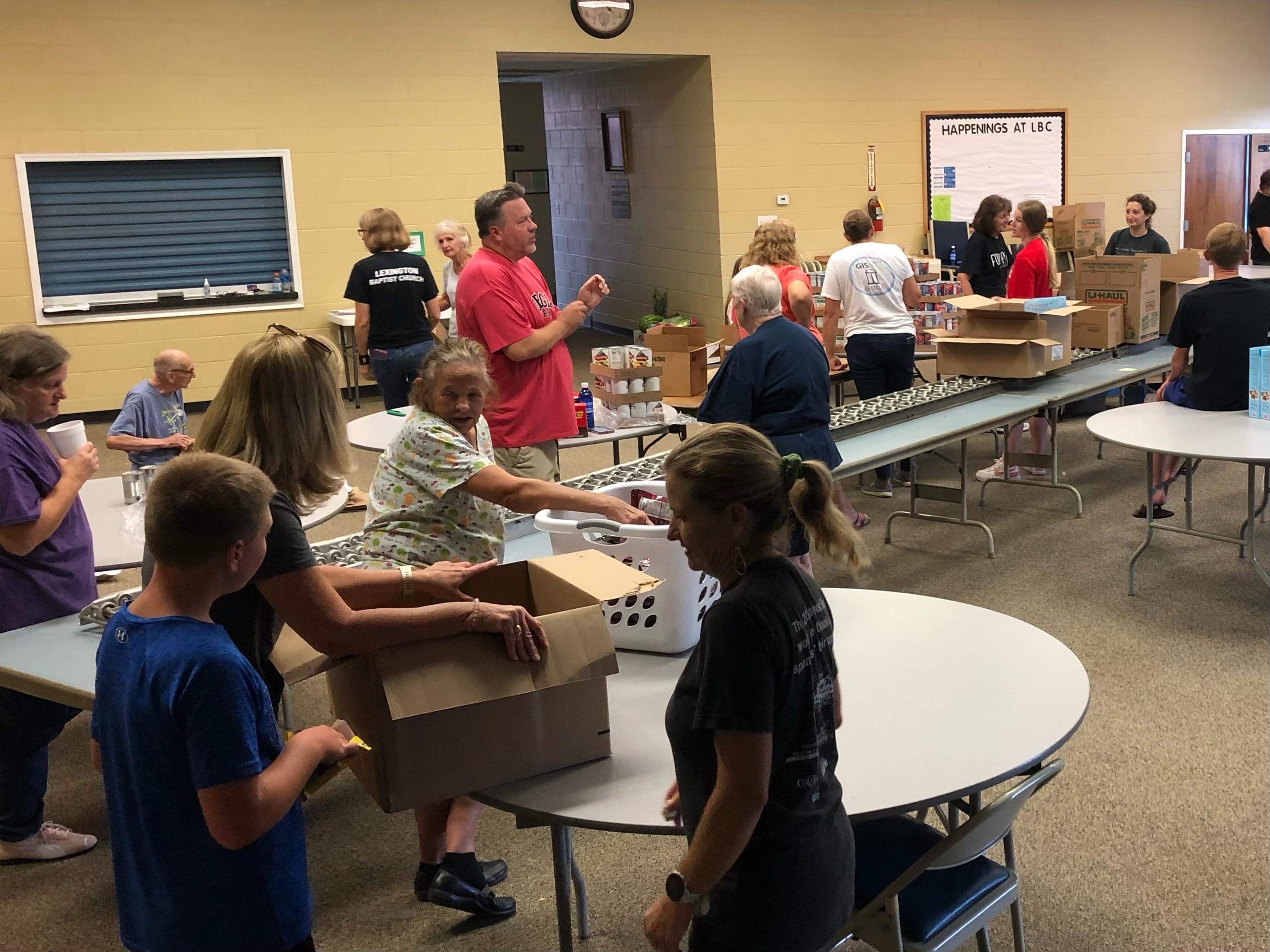 Volunteers at Lexington Baptist Church sort food into boxes for families visiting the mobile food pantry. The boxes of food are dispersed drive-through style every second Monday of the month. (Submitted Photo)
