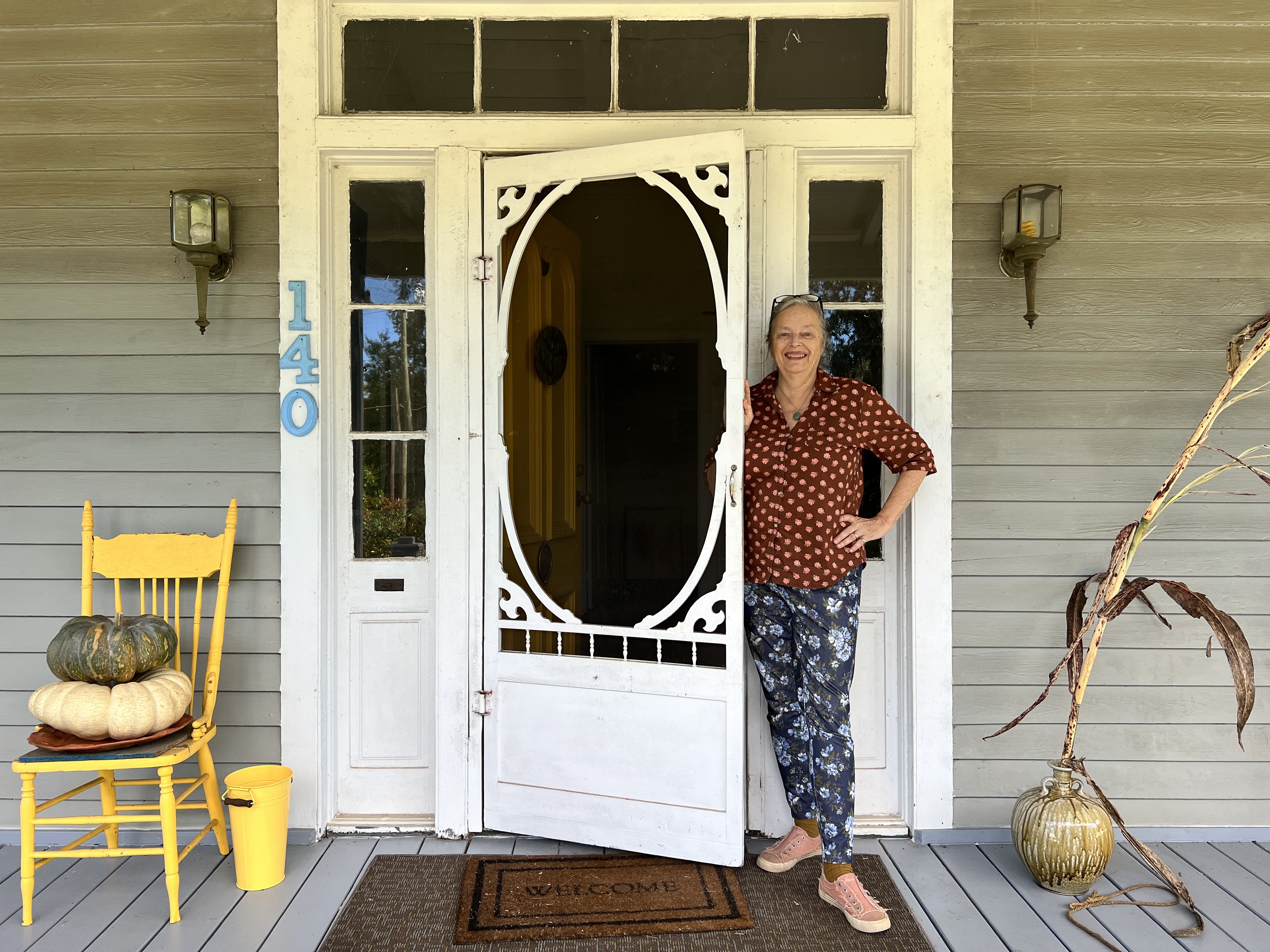 Well-known artist Rebecca Wood stands at the door of her Lexington home, one of many downtown Lexington locations on the Art Crawl on Saturday. (Megan Fitzgerald/The Oglethorpe Echo)