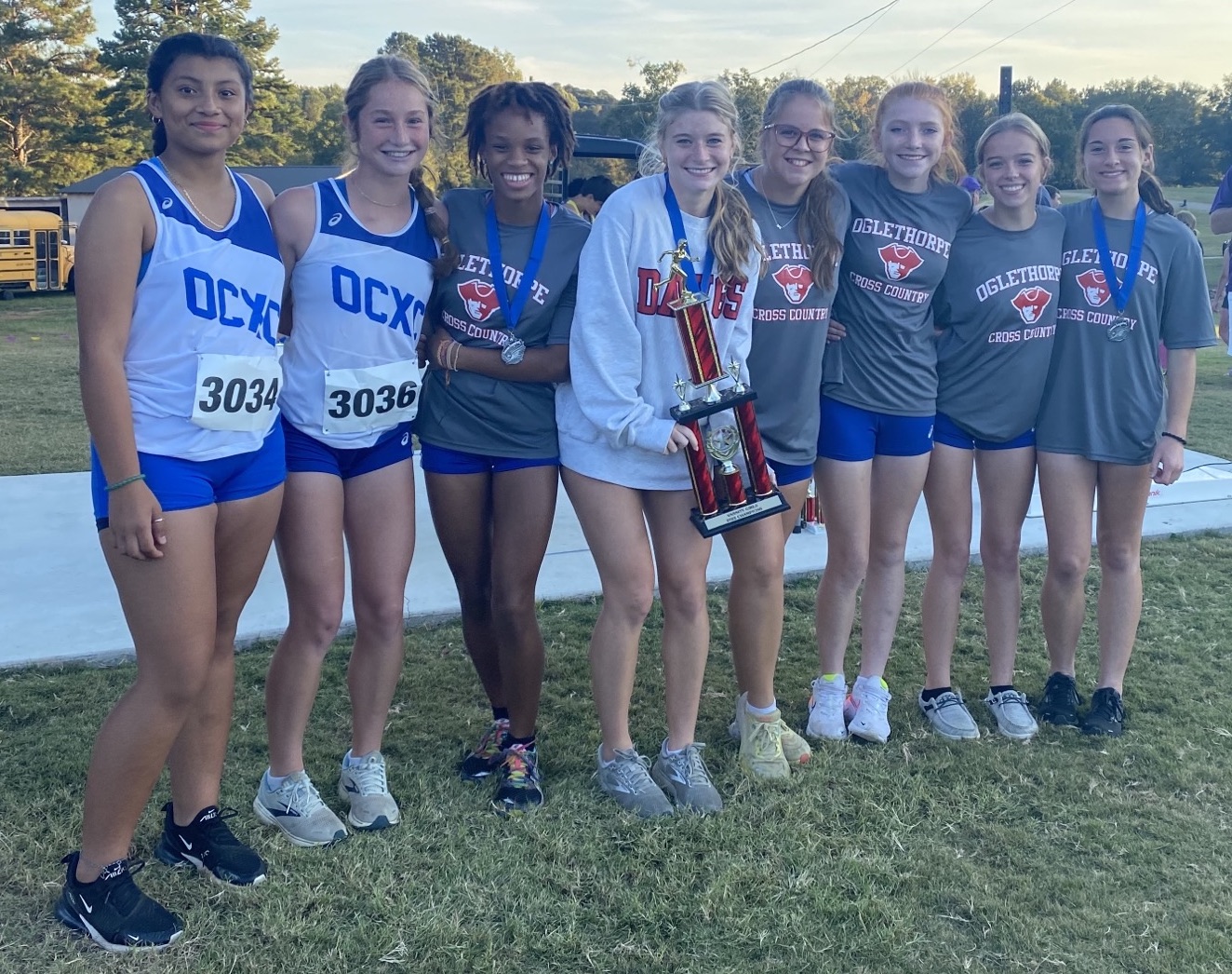 Lesley Ramirez (from left), Elin Turner, Sydnie Henderson, Lizzie  Wadsworth, Hannah Hemingway, Mylee Nimmons, Sarah Taft  and Harper Palmer led the Oglethorpe County girls cross country team to a win at the Kent Kramer Cross Country Classic. (Submitted Photo)