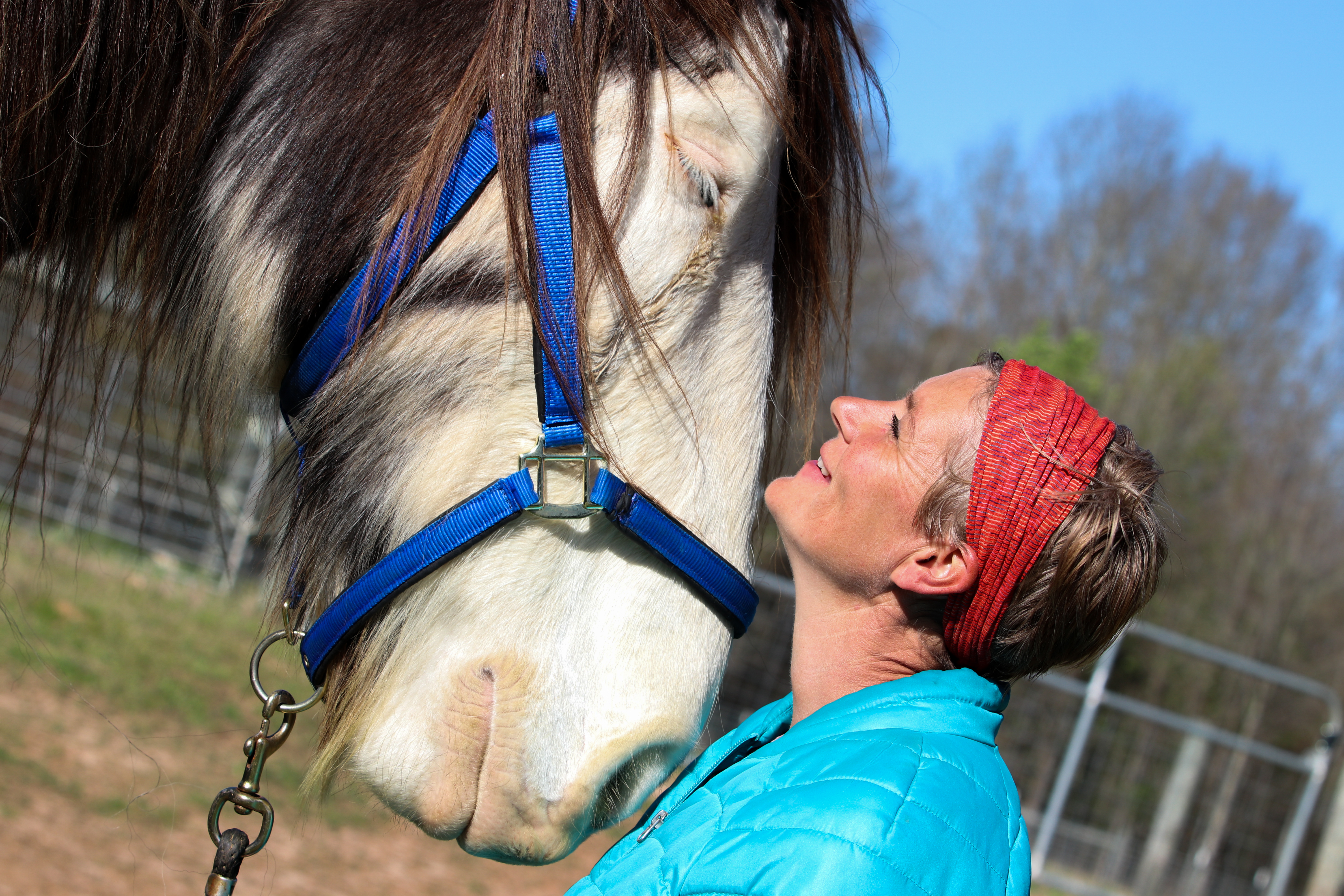 Meg Eades, a positive enforcement horse trainer and the primary trainer at ReDux Equine Rescue, works with Titan (horse), Saturday, March 26, 2022. (Photo/Aisha Schulz)