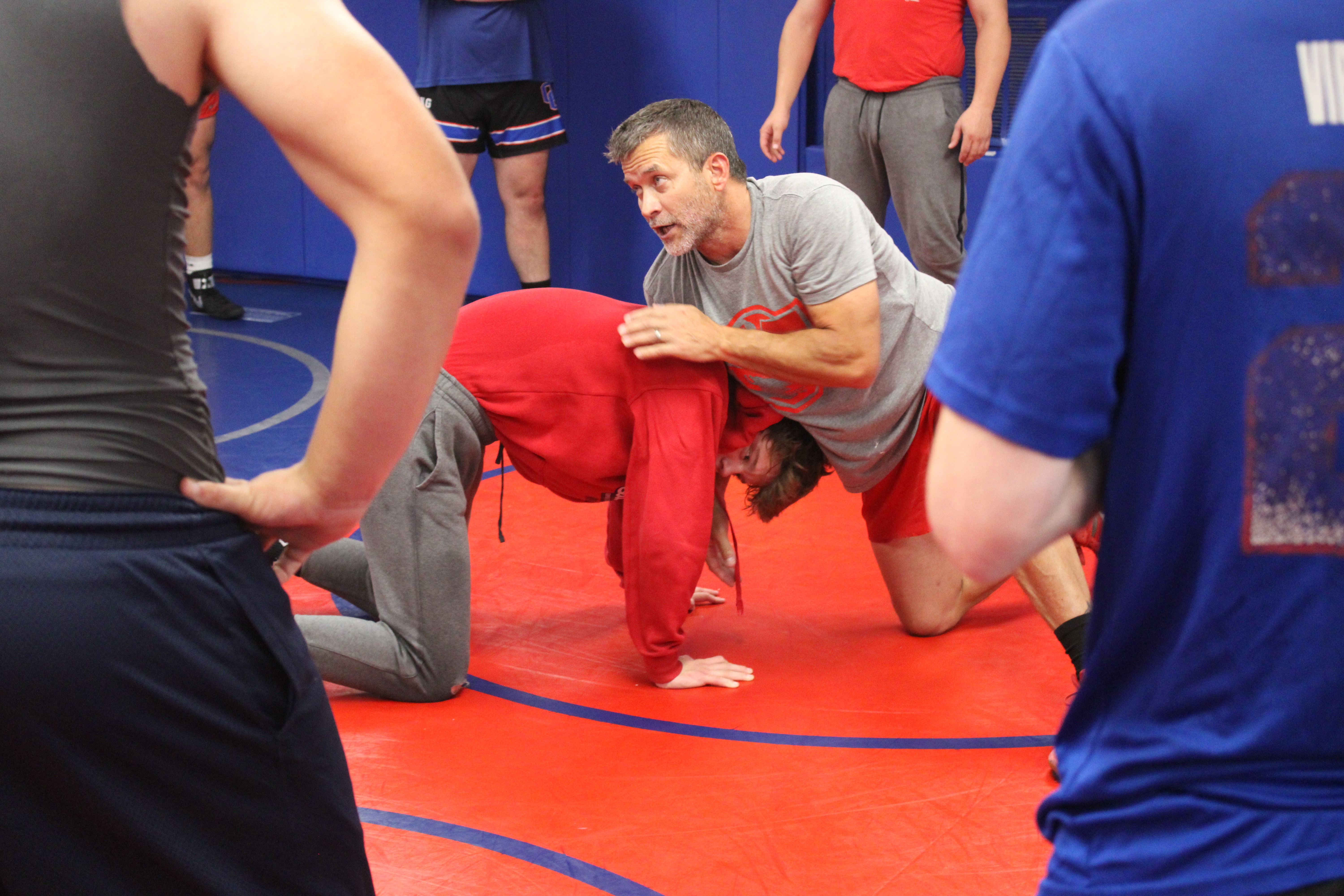 Coach Tim Stoudenmire demonstrates a move with Tanner Mask as the Oglethorpe County wrestling team prepares to open this season later this month. (De Turner/The Oglethorpe Echo)