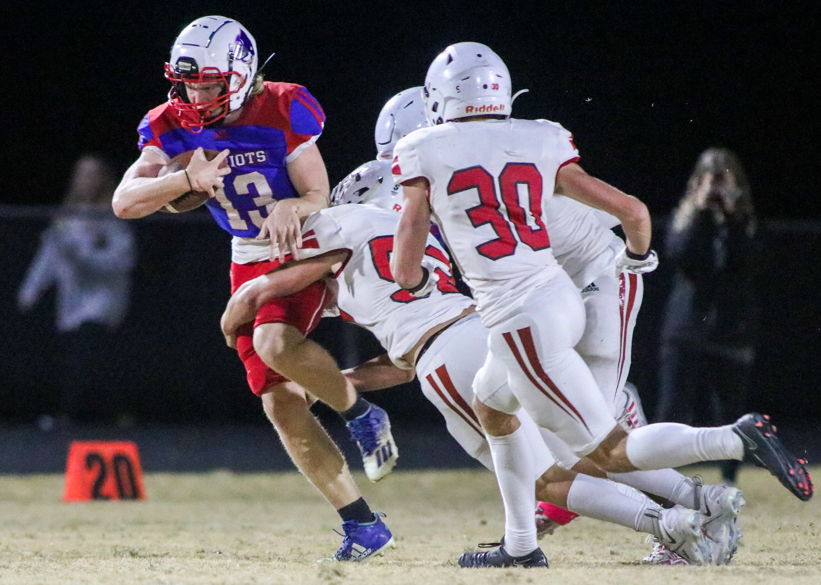 OCHS strong safety Nate Irwin attempts to break free from Social Circle defenders Grayson Jenkins and Bryan Ross. OCHS homecoming game, Friday, Oct. 28, 2022. (Aisha Schulz/The Oglethorpe Echo)