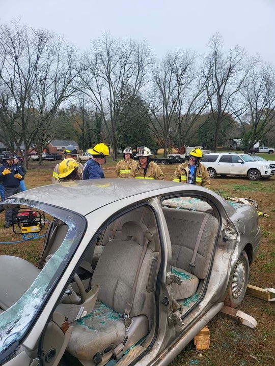 Firefighters learned how to remove the doors and windshield off of a car using hydraulic cutting tools. (Photo Courtesy/Jennifer King)