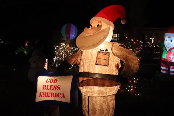 An inflatable Santa in U.S. military camouflage is part of the Christmas display in Wayne Loggans’ yard on North Street in Crawford. Loggans and his wife Tammy decorate their yard every year. (LJ Jackson/The Oglethorpe Echo)