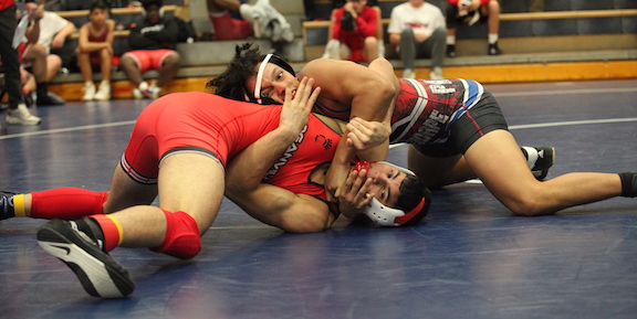 Jayce Brown gains the upper hand on his opponent in the 157-pound weight class during the Oconee County Round Robin tournament on Nov. 19. (Donny Faust/For The Oglethorpe Echo)