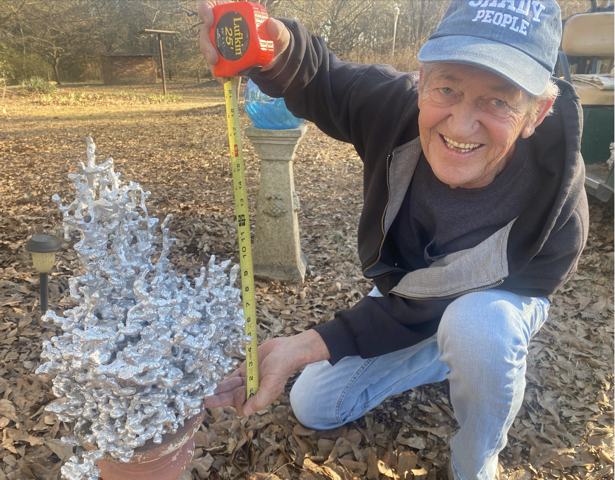 Alan Johnson displays one of the sculptures that’s created when he and longtime friend Benjamin Huish pour molten aluminum into anthills. (DINK NESMITH/THE OGLETHORPE ECHO) 