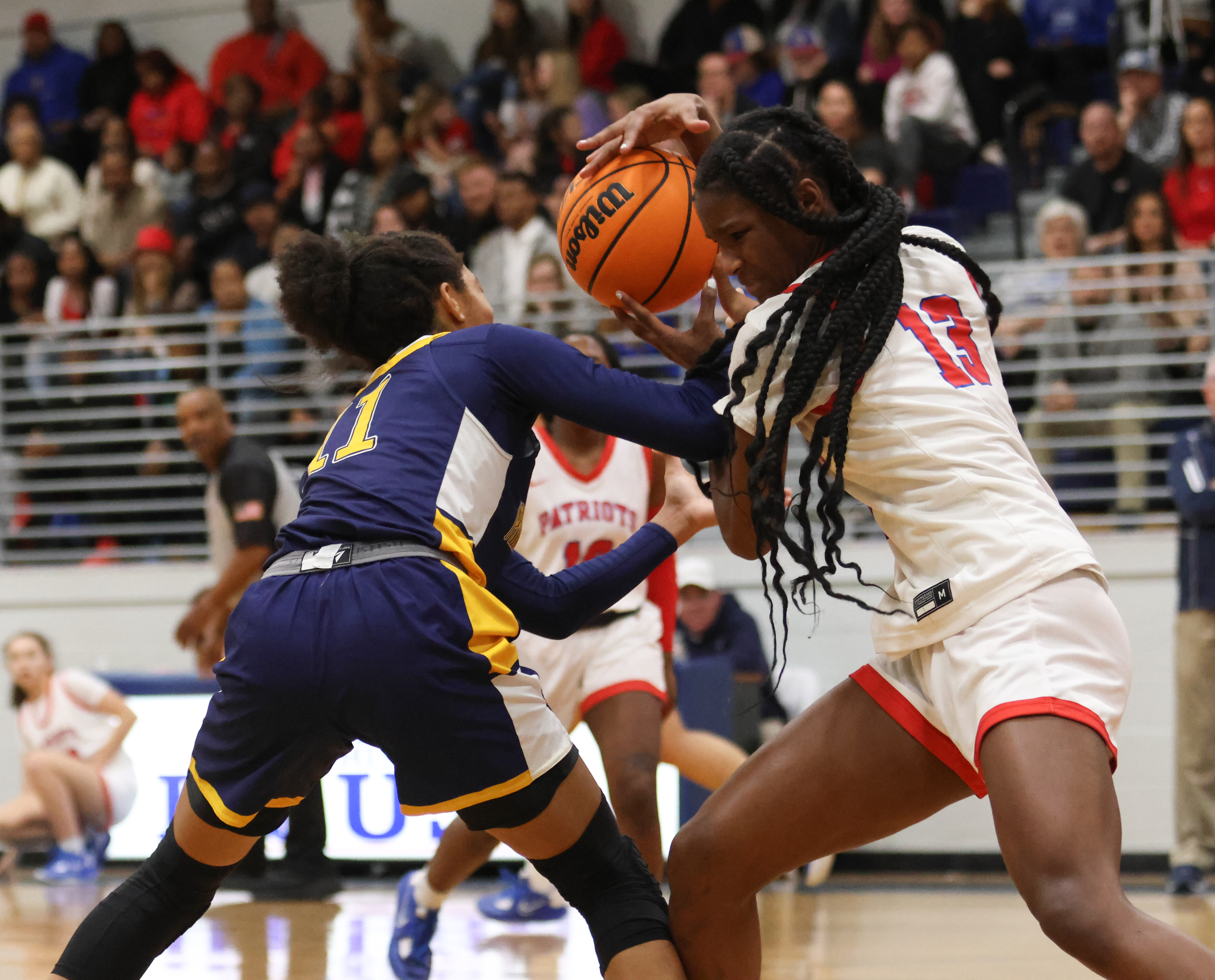 Kenzie Henderson, a sophomore, plays keep-away from her opponent in a basketball game between Oglethorpe County High School and Prince Avenue Christian School on Feb.3, 2023. The Patriots defeated the Wolverines 58-57 in the region matchup. (Photo/Emily Dozier)