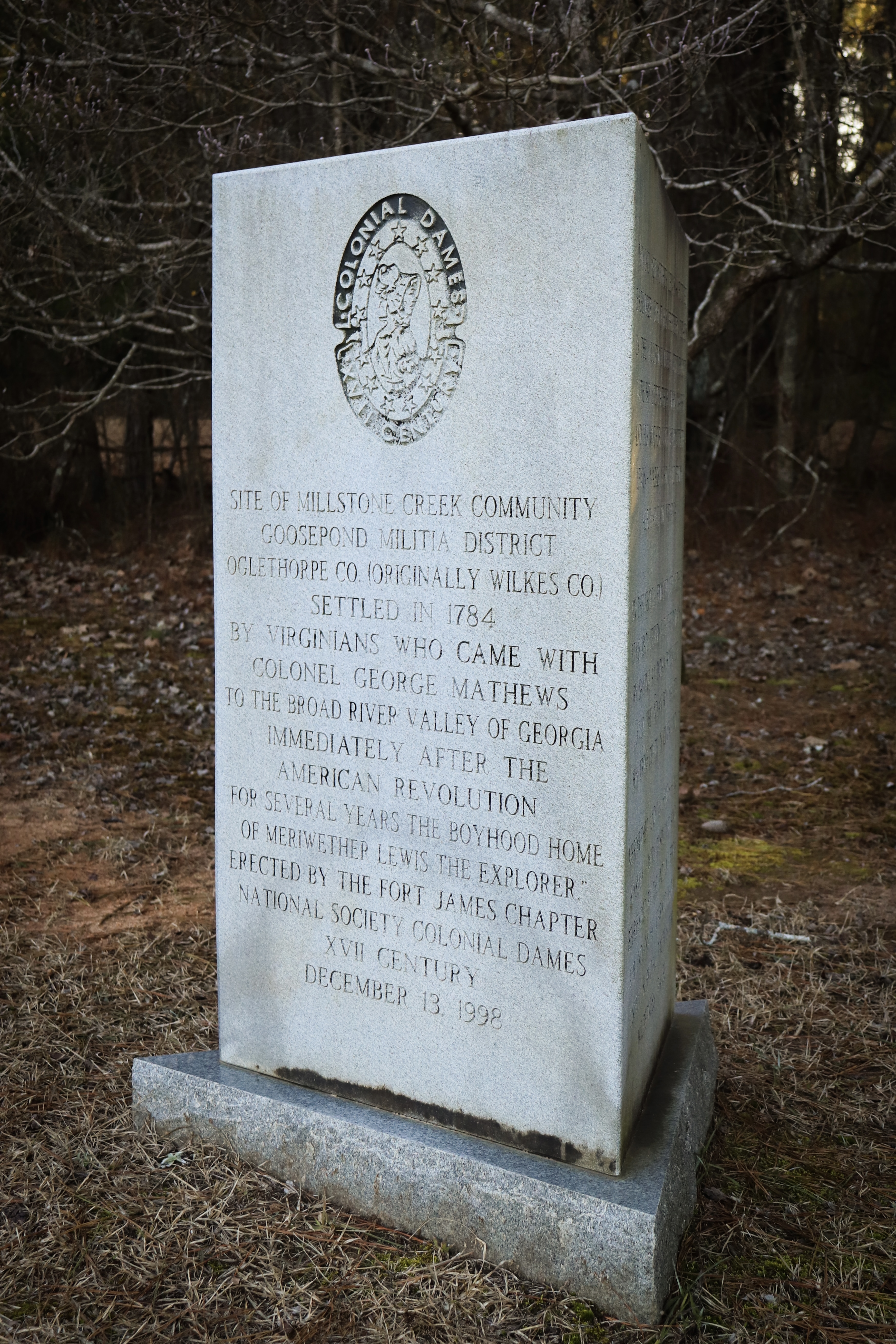 A marker outside Millstone Baptist Church commemorates the Millstone Creek community homesteaders, including famed explorer Meriwether Lewis, who spent part of his childhood there. The monument was moved to the churchyard from its original location due to issues with vandalism. (Photo/Maddie Daniel)