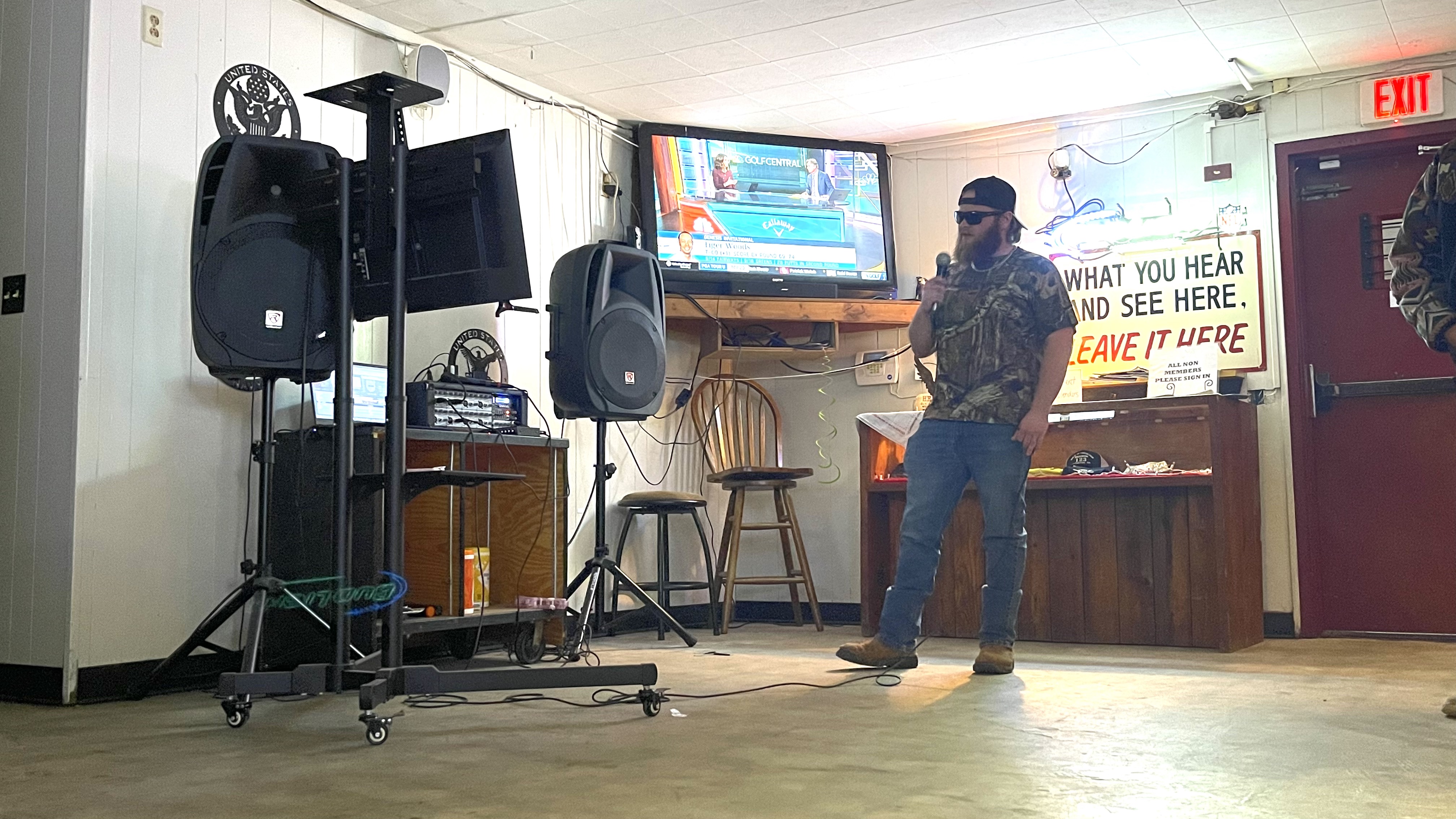 Carl Herring sings "God's Country" by Blake Shelton at karaoke night at the James T. Rayle American Legion Post 123 in Lexington. He likes to change the pace by singing recent country hits instead of songs from the 1980s and ’90s. (Photo/Olivia Shapiro)