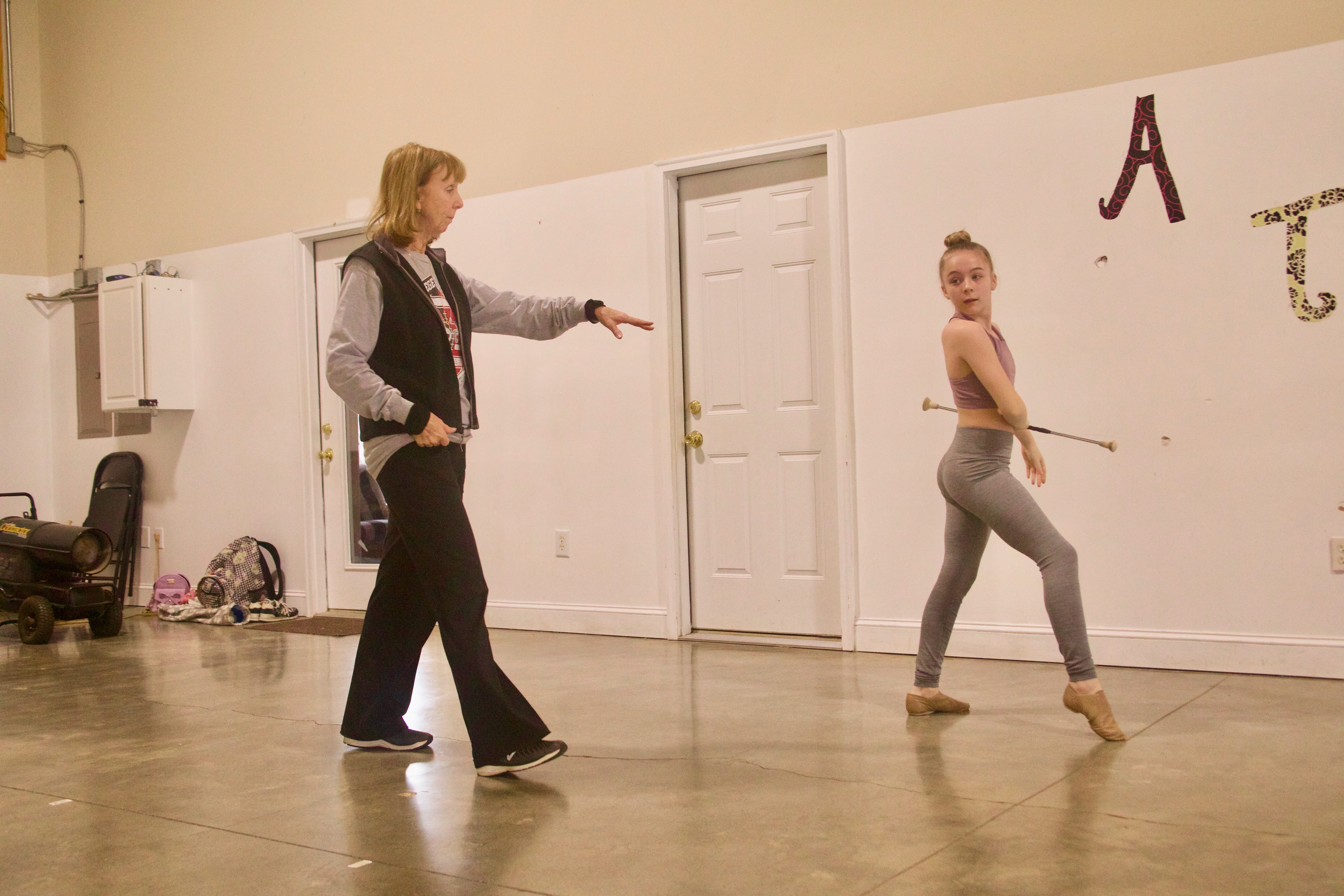 Polly Fleming, who said she has almost “an unhealthy love for twirling,” coaches Kassie Mathews at her studio in Crawford. Fleming has coached twirling since her freshman year at Abraham Baldwin Agricultural College. (Photo/Olivia Shapiro)