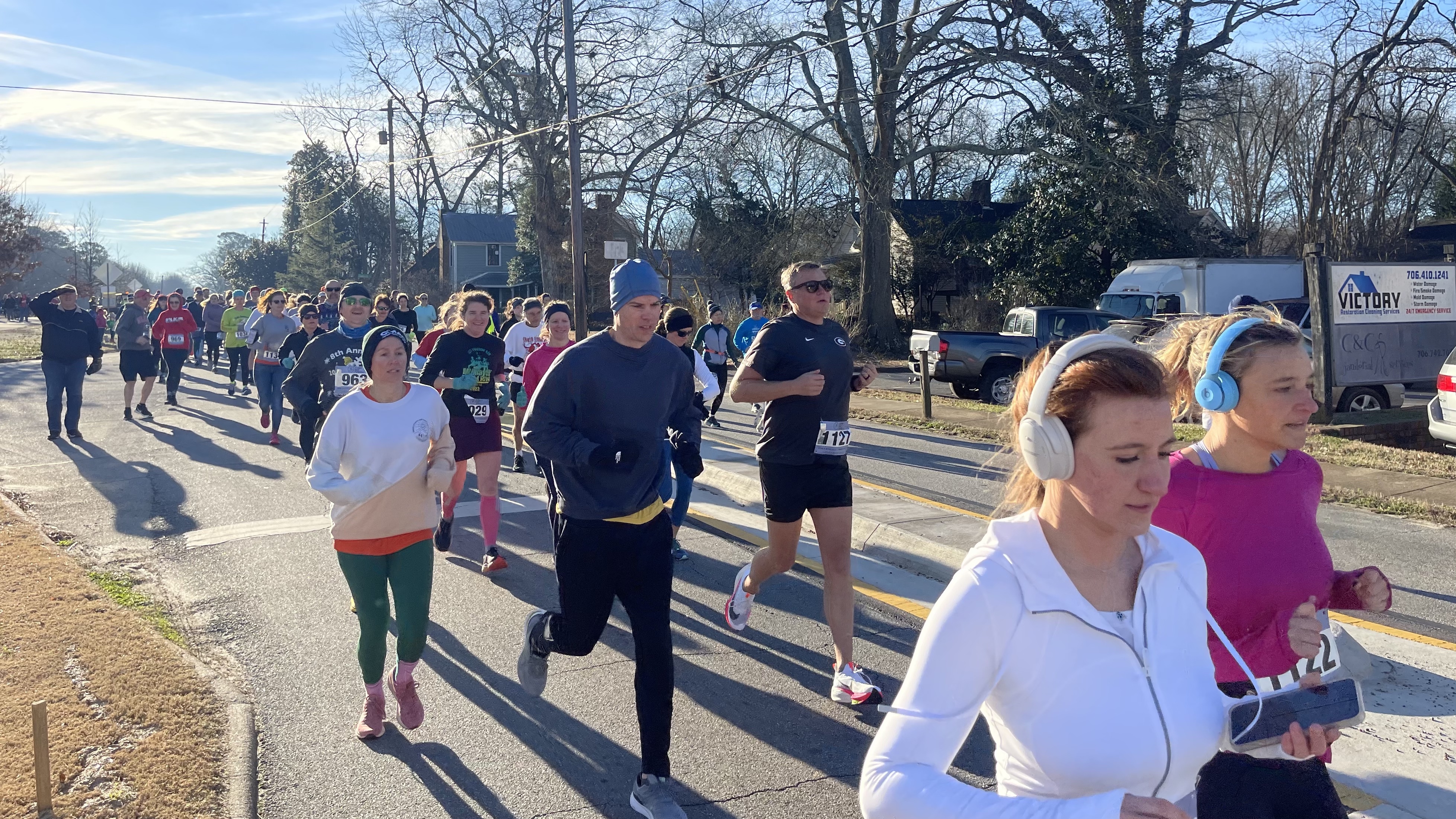 Runners take off at the start of the Winterville Civitan Snowflake 10K on Saturday. There were 210 runners, of which 170 raced in person. (Photo/Olivia Shapiro)