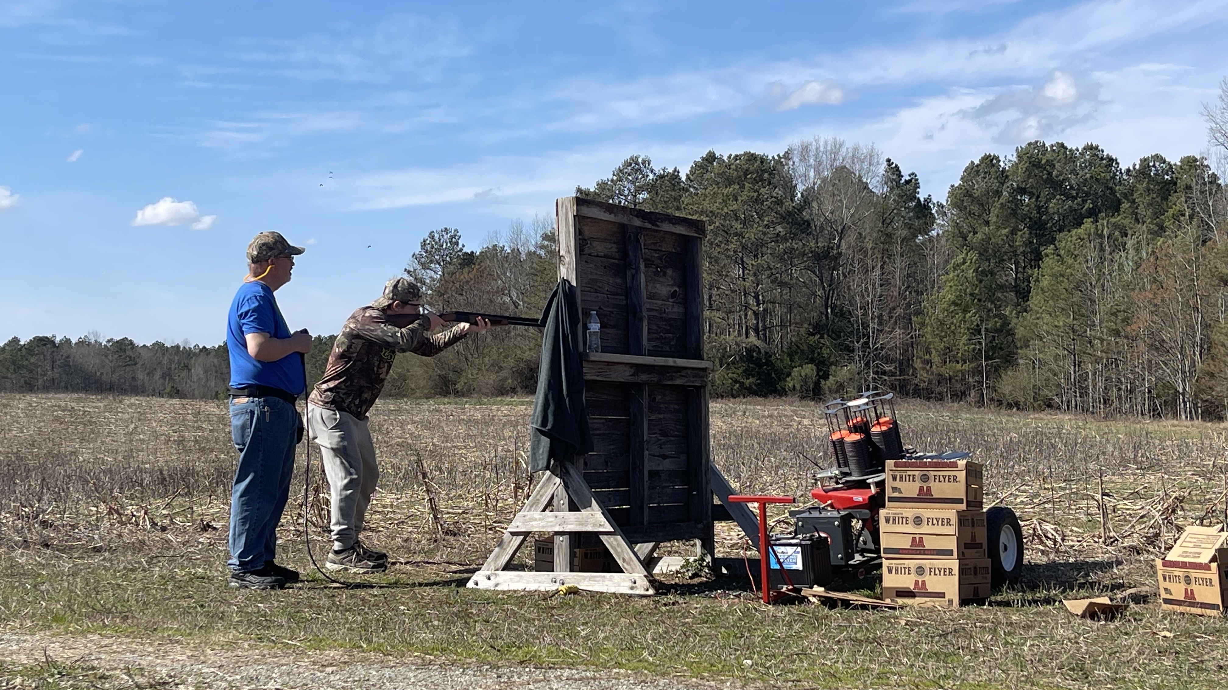 Jacob Spidle, a senior at Oglethorpe County High School, practices with his dad David Spidle, who is one of several coaches with the 4-H shotgun team. Jacob Spidle hopes to finish in the top five at state this year. (Photo/Olivia Shapiro)