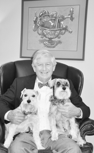 My Augusta friends, Abram and Cookie Serotta, sent me three red and black bow ties. The UGA grads loved Amos and Andy, too. This photo was taken in my office. Above my head is a Jack Davis print that Bulldog great Lindsay Scott autographed, along with his 1980 national championship teammates. 