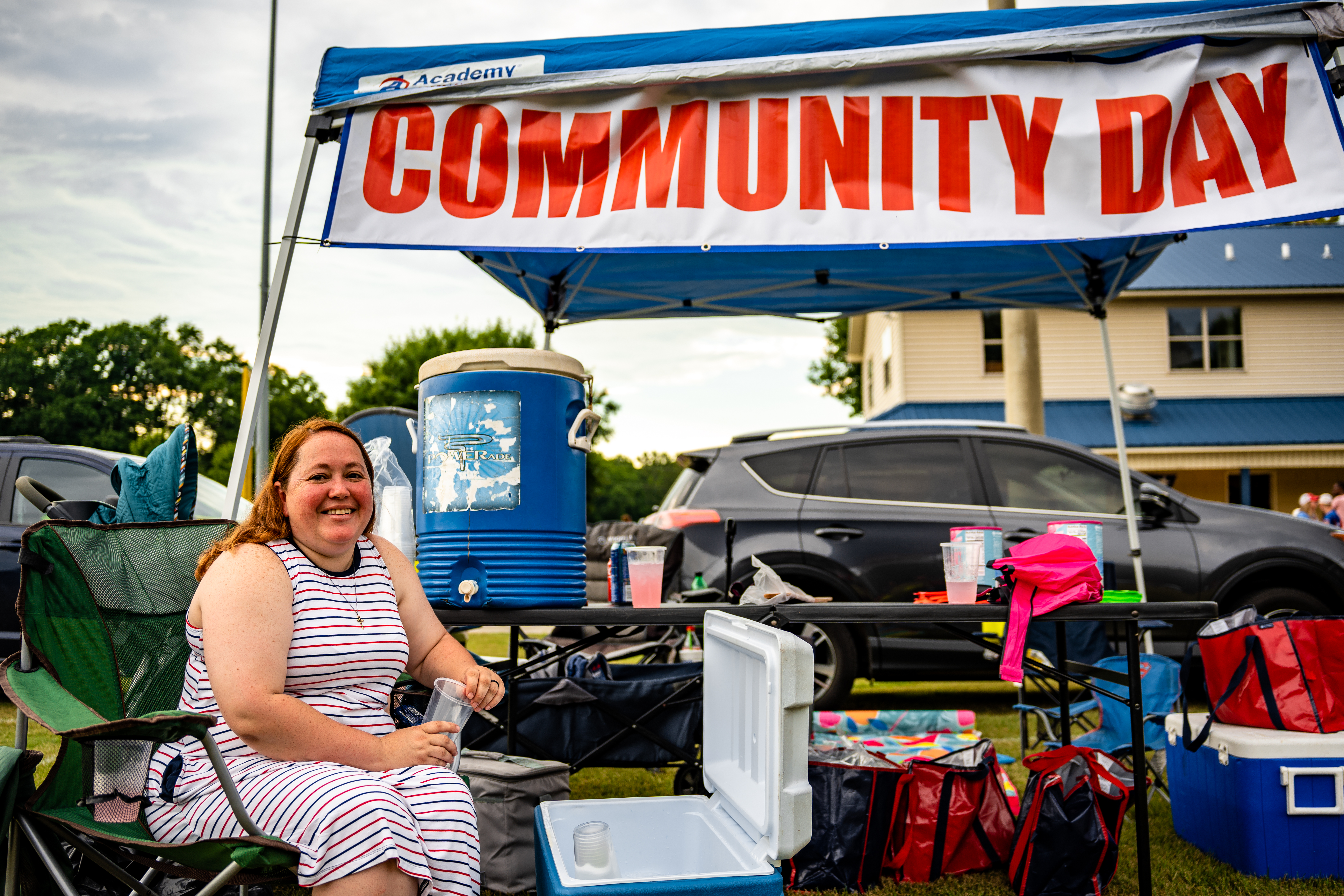 Jeanne Jones staffs the Community Day tent during last year’s Fourth of July celebration at Bryan Park. Community Day is held just before the start of the school year to give supplies to students and help prepare them for the school year. (JACK CASEY/THE OGLETHORPE ECHO)