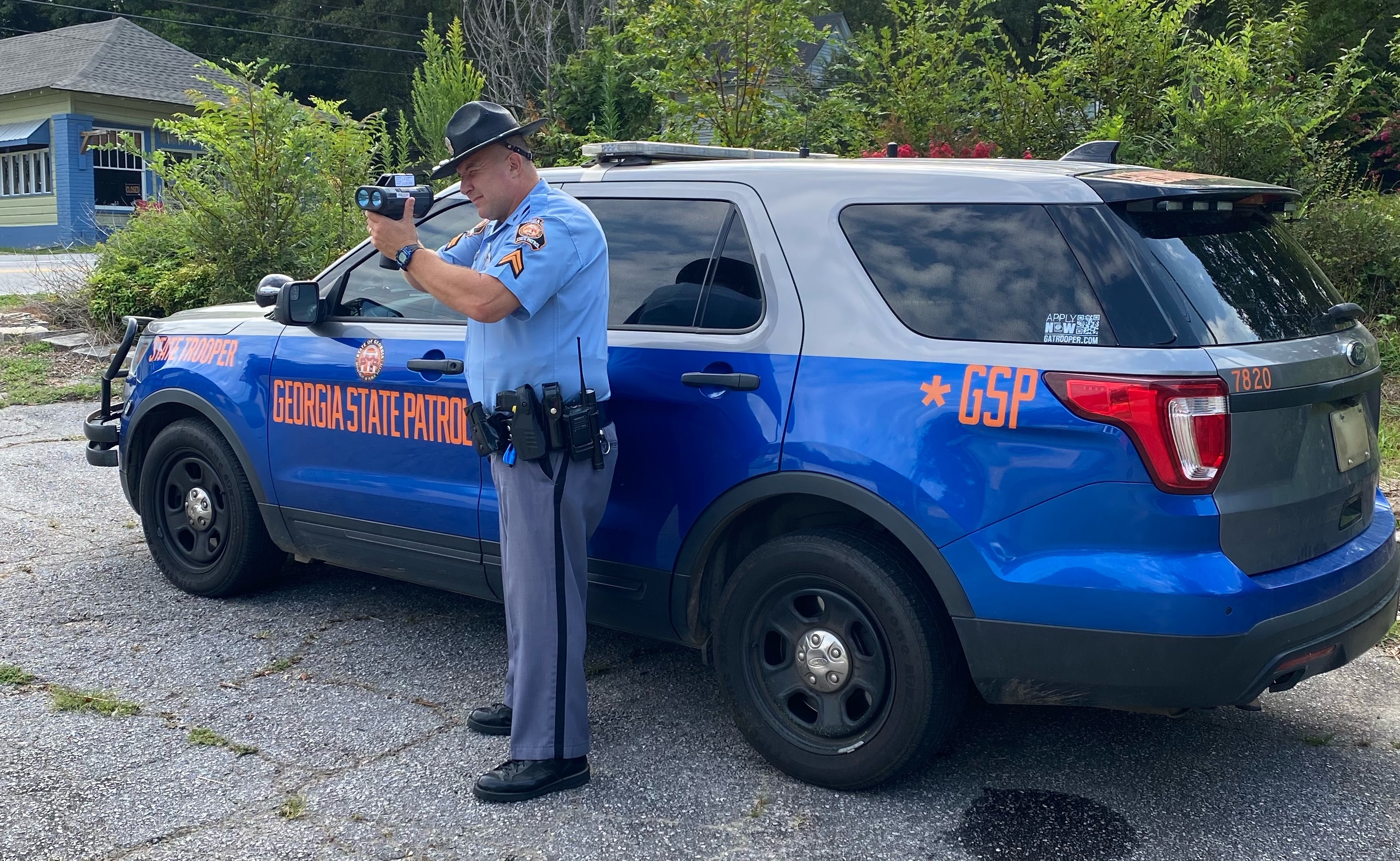 Cpl. Neil Frankel with the Georgia State Patrol points his laser at drivers in downtown Lexington earlier this week. He and other troopers will patrol the school zones in both the morning and afternoon when schools start next week. (TANYA EIDSON/THE OGLETHORPE ECHO)