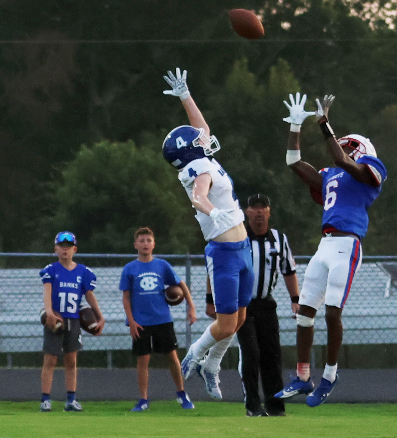 Oglethorpe County’s Darius Heard leaps to pull in a 13-yard touchdown pass over Banks County’s Caden Watson for the Patriots’ first touchdown in their 19-14 loss to Banks County in Lexington on Friday night. (NOOR ABDALLAH/THE OGLETHORPE ECHO)