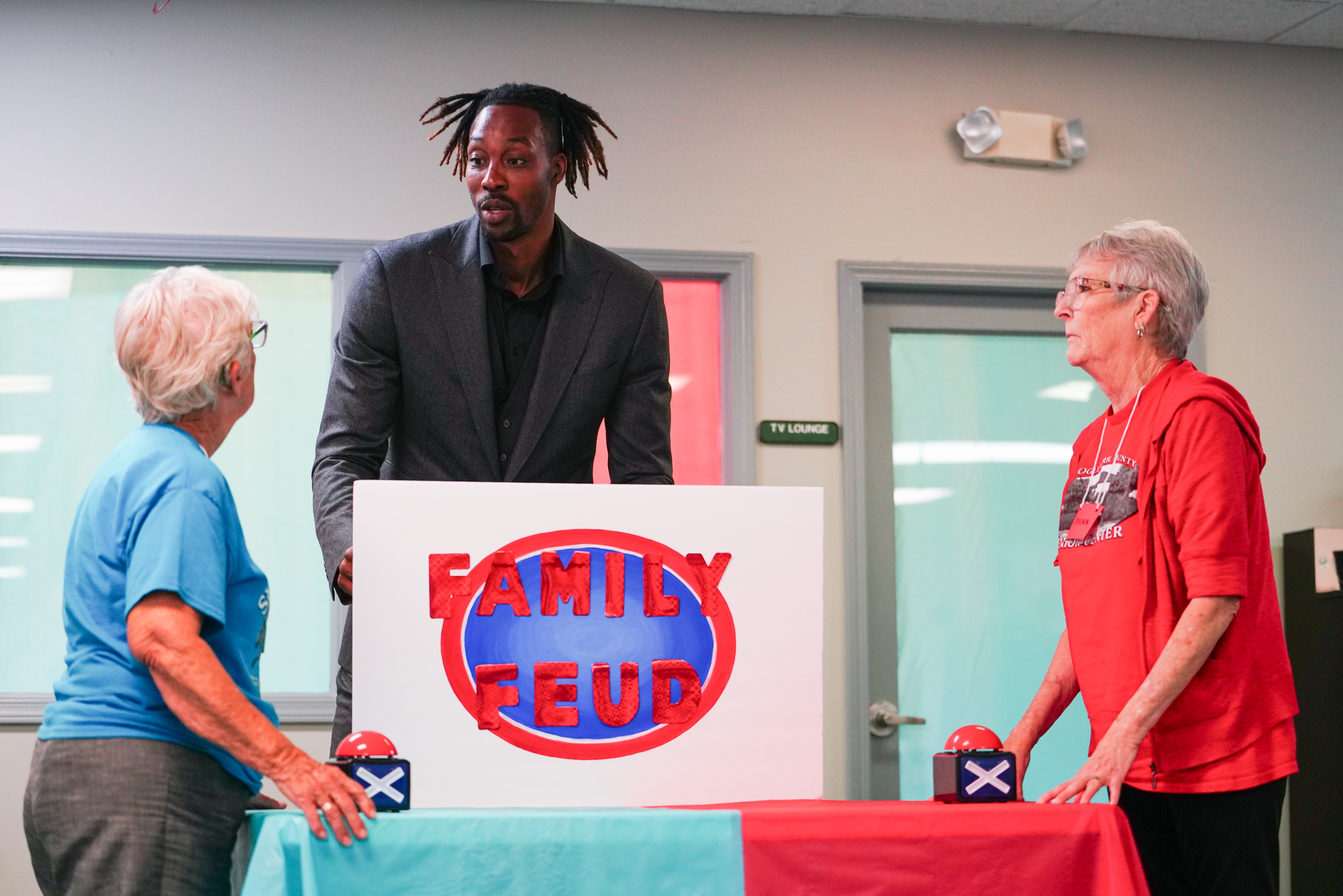 Sonja Armour and Vivian Sparks listen for the question from NBA All Star Dwight Howard on Friday morning, Sept. 15, 2023. Howard hosted 'Family Feud' at the Oglethorpe Senior Center in Crawford, Georgia. (Photo/Sidney Chansamone)