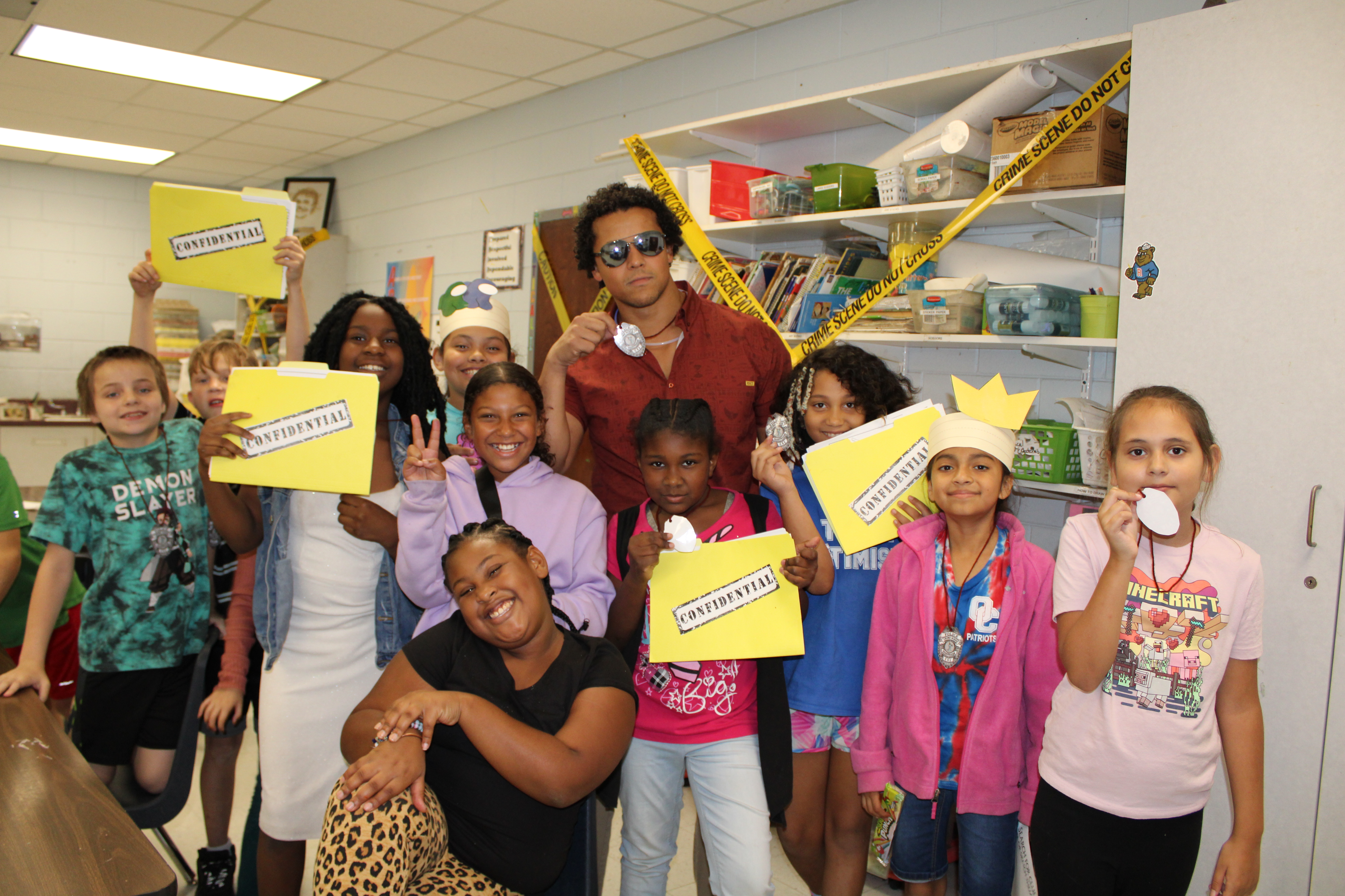 ohn Lutz’s art room was turned into a crime scene for Rock Your School day. The class used their art skills to color suspects and use confidential files to identify the criminal. (Photo/Caleb Baldwin)