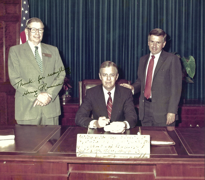  Larry Walker Jr. spent 32 years in the Georgia House of Representatives. One of many achievements was to persuade the General Assembly and the governor to build improved fair facilities. In this 1985 photo, Gov. Joe Frank Harris, center, signs the legislation creating the Georgia Agricenter. On the left is Rep. Henry Reaves, chair of the House agriculture committee. On the right is Rep. Larry Walker Jr. The bill paved the way for the Georgia National Fair complex in Perry, Walker’s hometown.