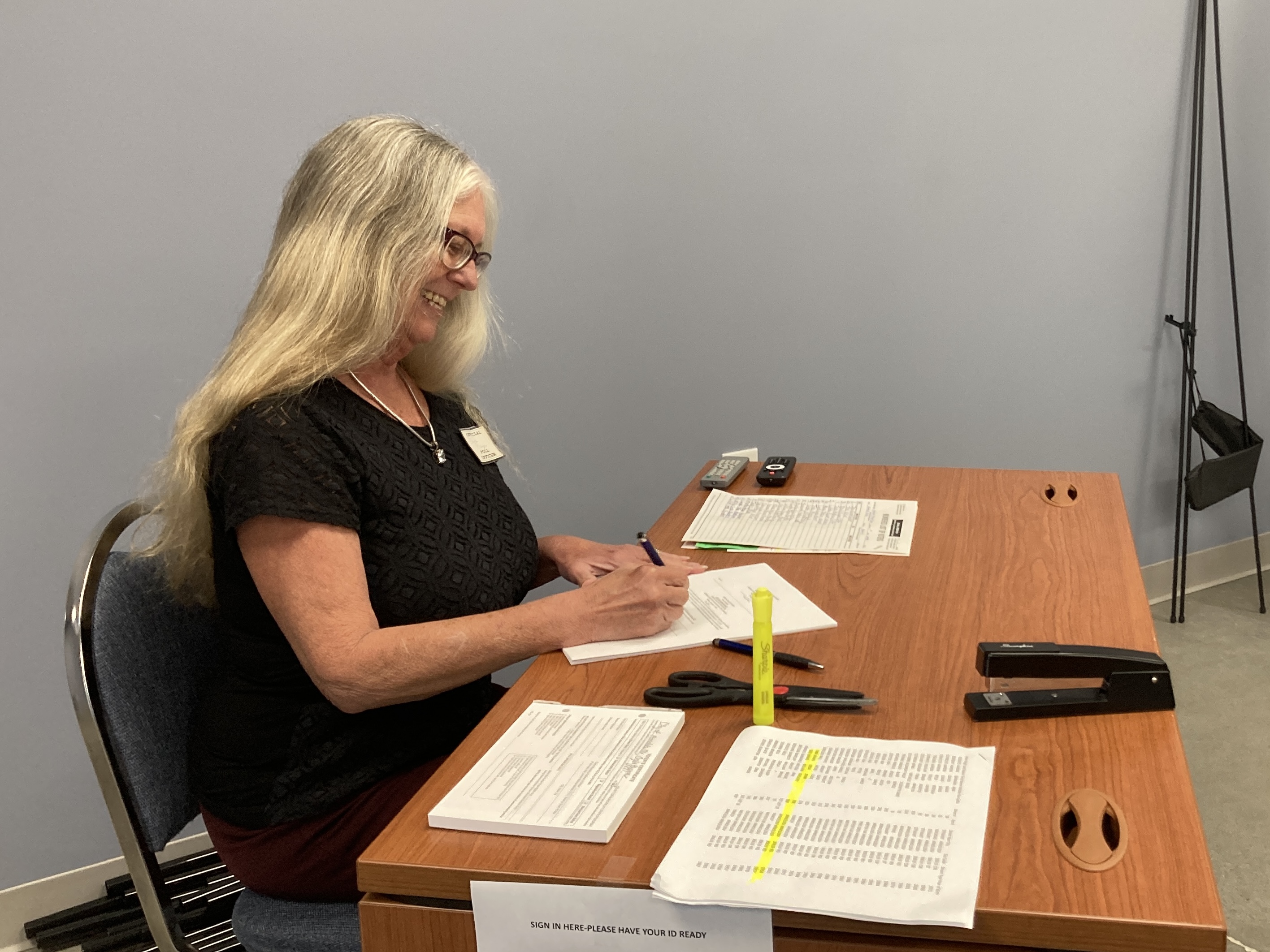 Dana Player, Arnoldsville city clerk and elections superintendent waits to check in voters at City Hall earlier this week. Early voting for the general and special elections began on Oct. 16, and Election Day is Nov. 7.