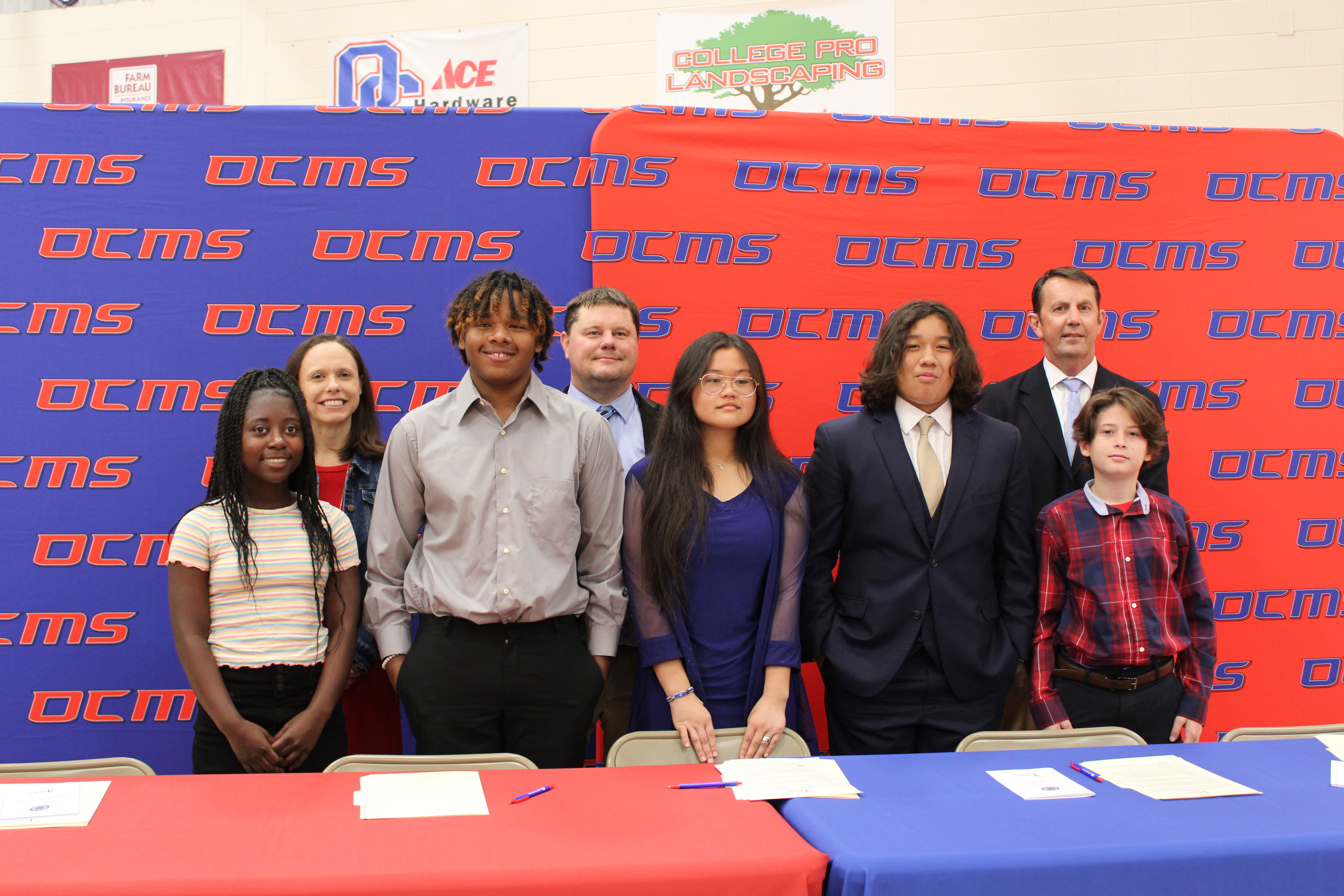 Jimmyka Gresham (front row, from left), Damarcuse Harper, Gloria Hgay, Jeffrey Molina and Zachary Wilson, eighth-graders at Oglethorpe County Middle School, are the newest class of REACH scholars. They must abide by the contract to receive a $10,000 scholarship when they graduate high school. Behind them are principals of Oglethorpe Schools: Katie Baldwin (from left), primary and elementary schools; Mack Baldwin, middle school; Bill Sampson, high school. (Caleb Baldwin/The Oglethorpe Echo)