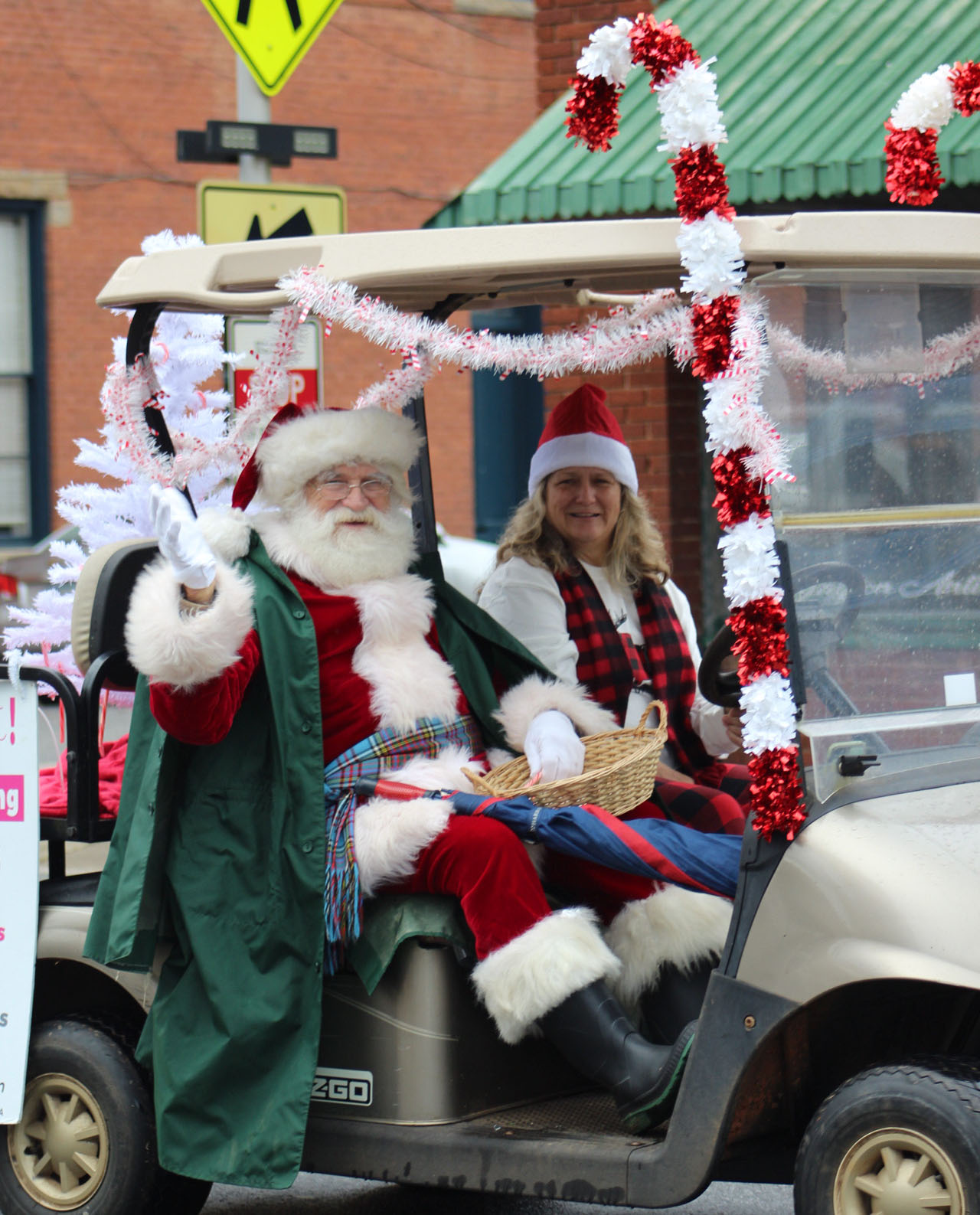 The Christmas in Oglethorpe parade ended with a greeting from Santa Claus, who threw out candy to the spectators while riding his golf cart. The parade was full of various sponsors who led floats down Main Street. (Lily Reid Aldrich/The Oglethorpe Echo))