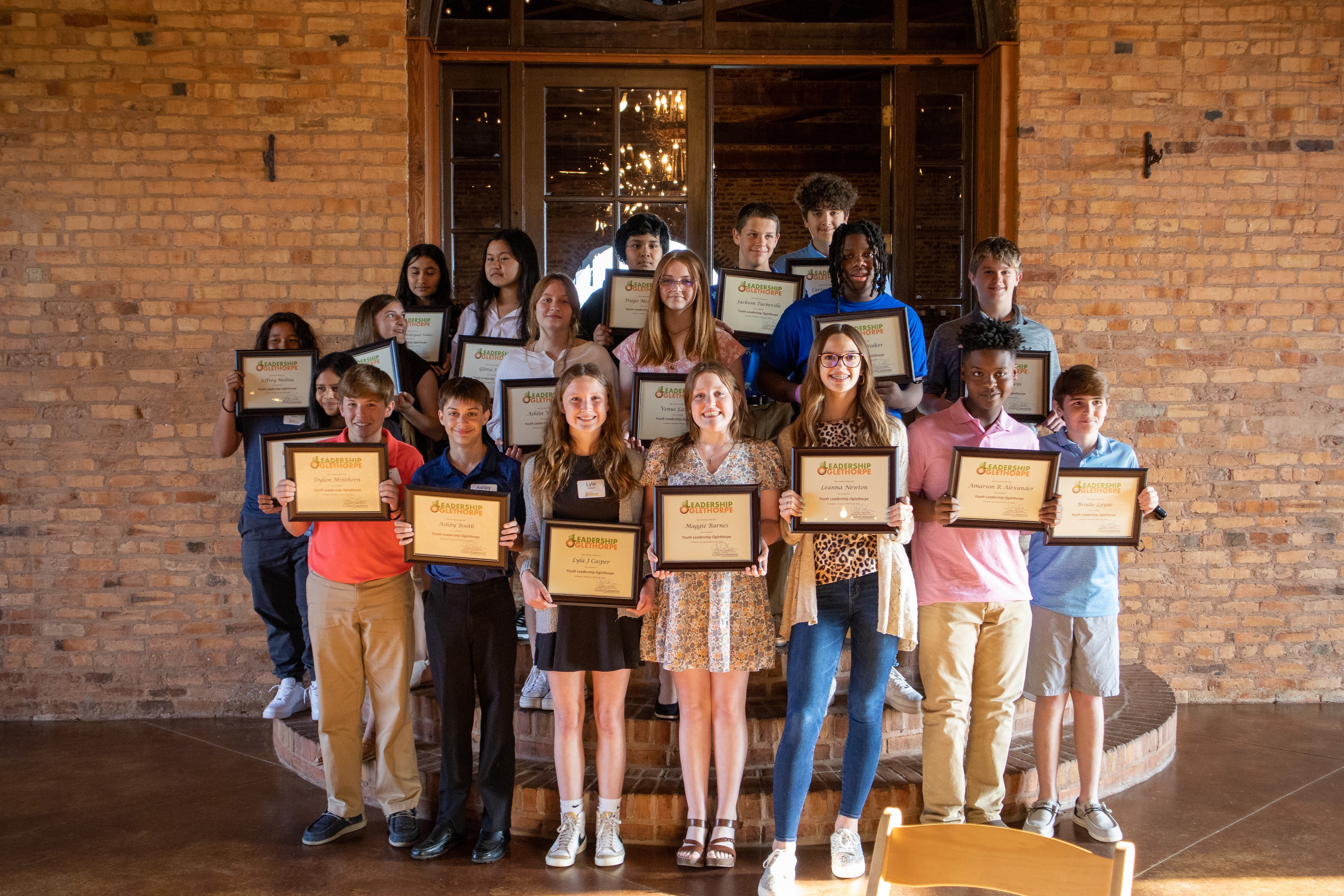 Members of last year’s Leadership Oglethorpe program for middle school students display their certificates during the graduation ceremony. This year’s program begins next month. (Submitted Photo)