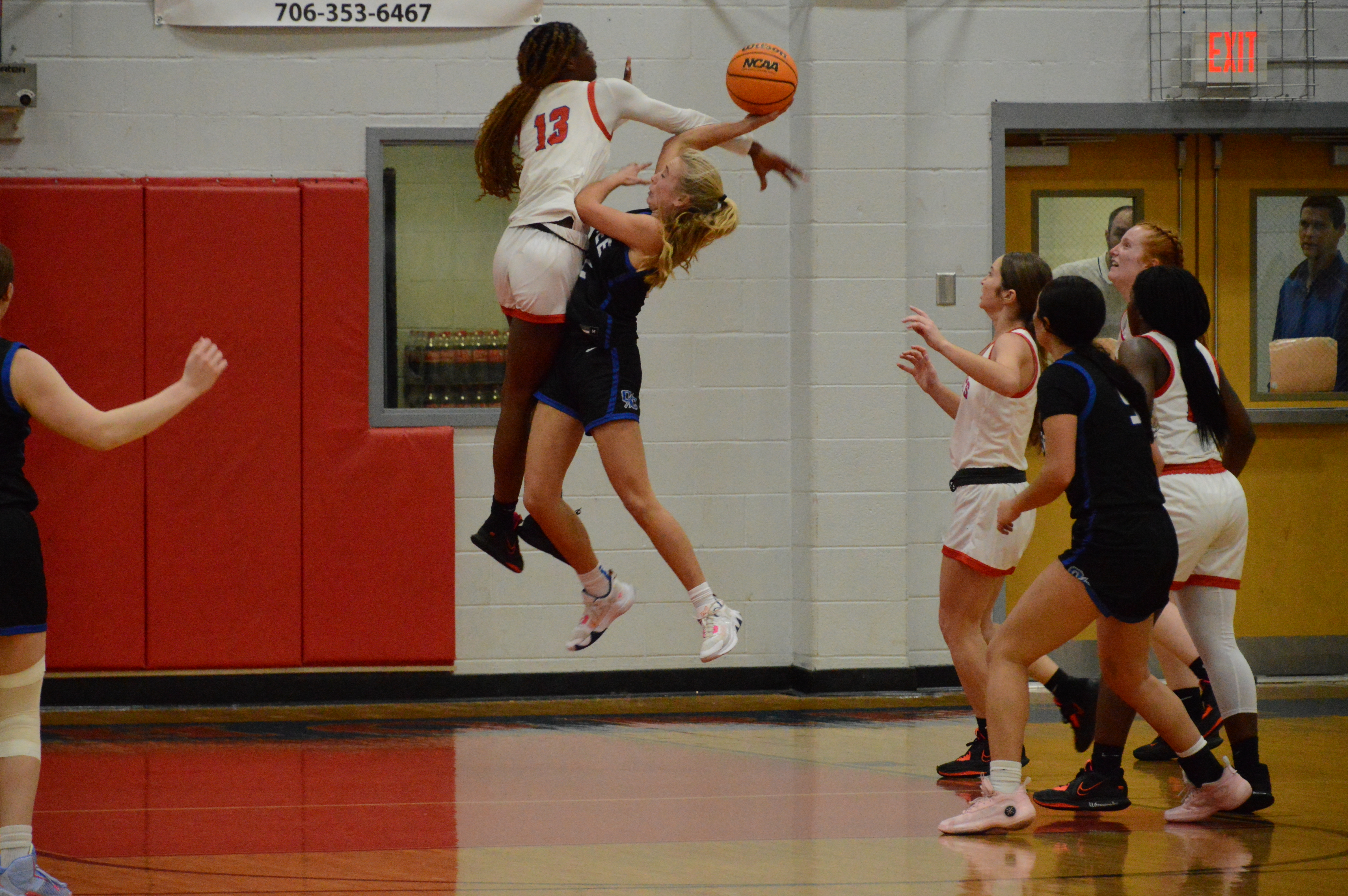Kenzie Henderson blocks No. 22 Jill Daniel's shot at the basketball game against Oconee County on Jan. 6. Oglethorpe County girls won 53-43. (McCain Bracewell/The Oglethorpe Echo)