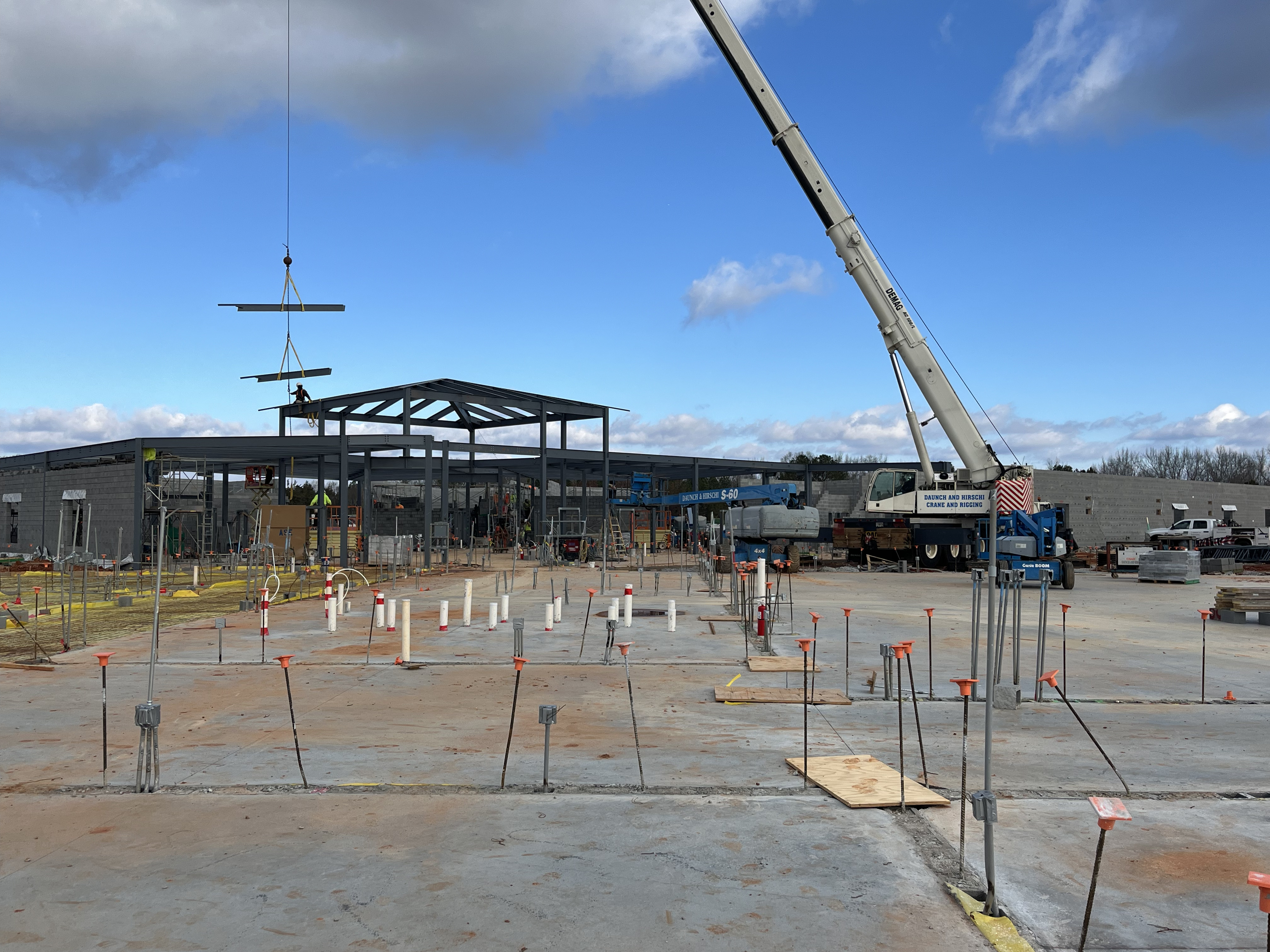 A crane moves a beam to the roof of the new Oglethorpe Elementary School. The school is on track to have students enter by January 2025. (Photo/Jim Bass)