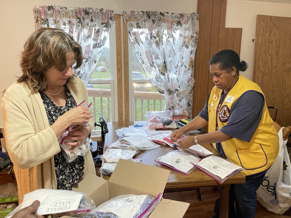  Dee Pelewski (left),  treasurer of Oglethorpe County Lions Club, and volunteer Emma Walter package pajama packs for Piedmont Athens Regional. The packs include new pajamas, underwear, socks, and sometimes blankets and activities for the children with extended stays. (Submitted Photo). 