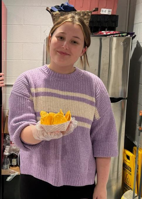 Camille Thomas works concessions at the rec department to help raise money for the marching band. (Submitted Photo)