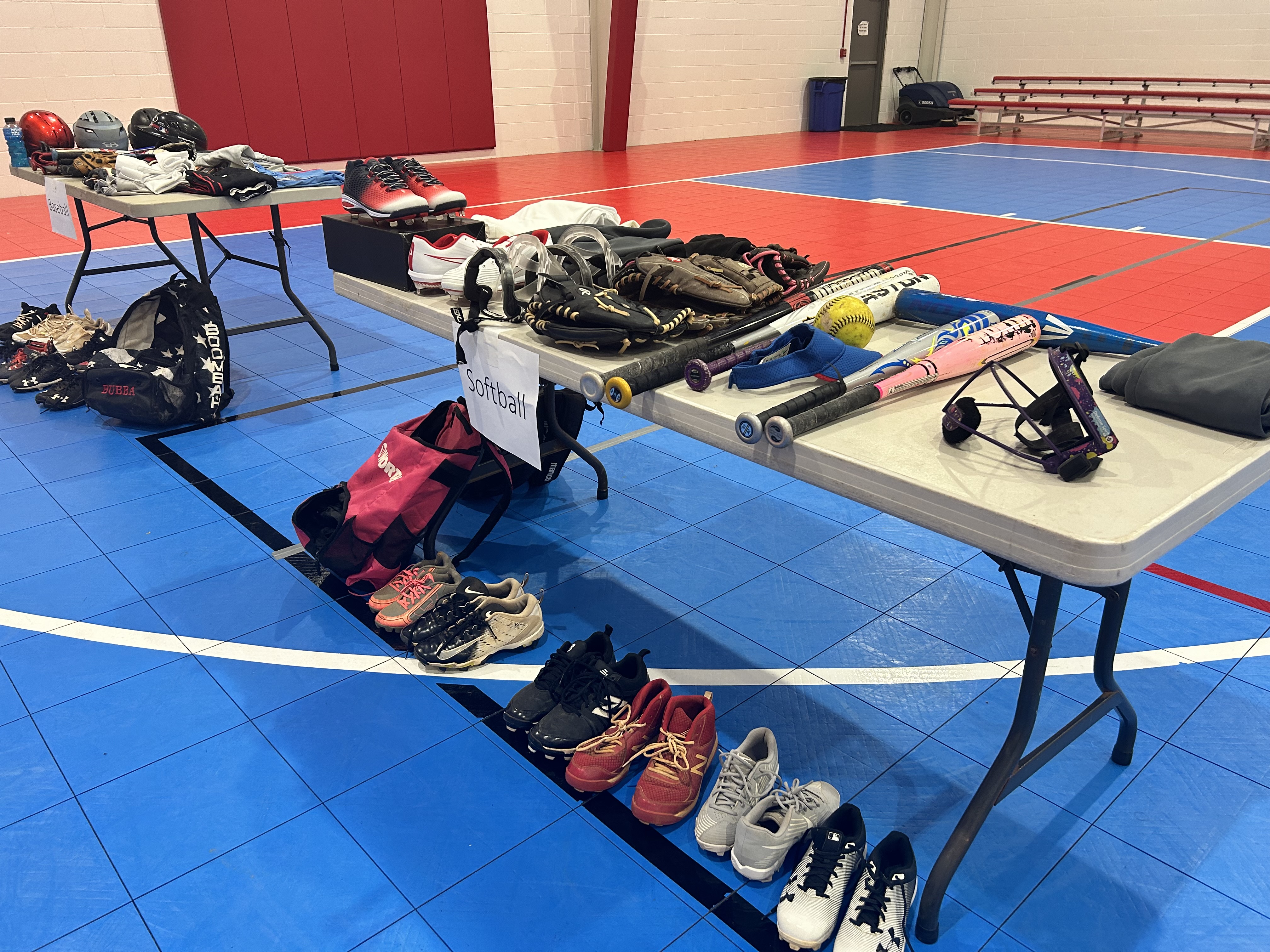[Photo by Micahya Costen]The softball and baseball table set up.