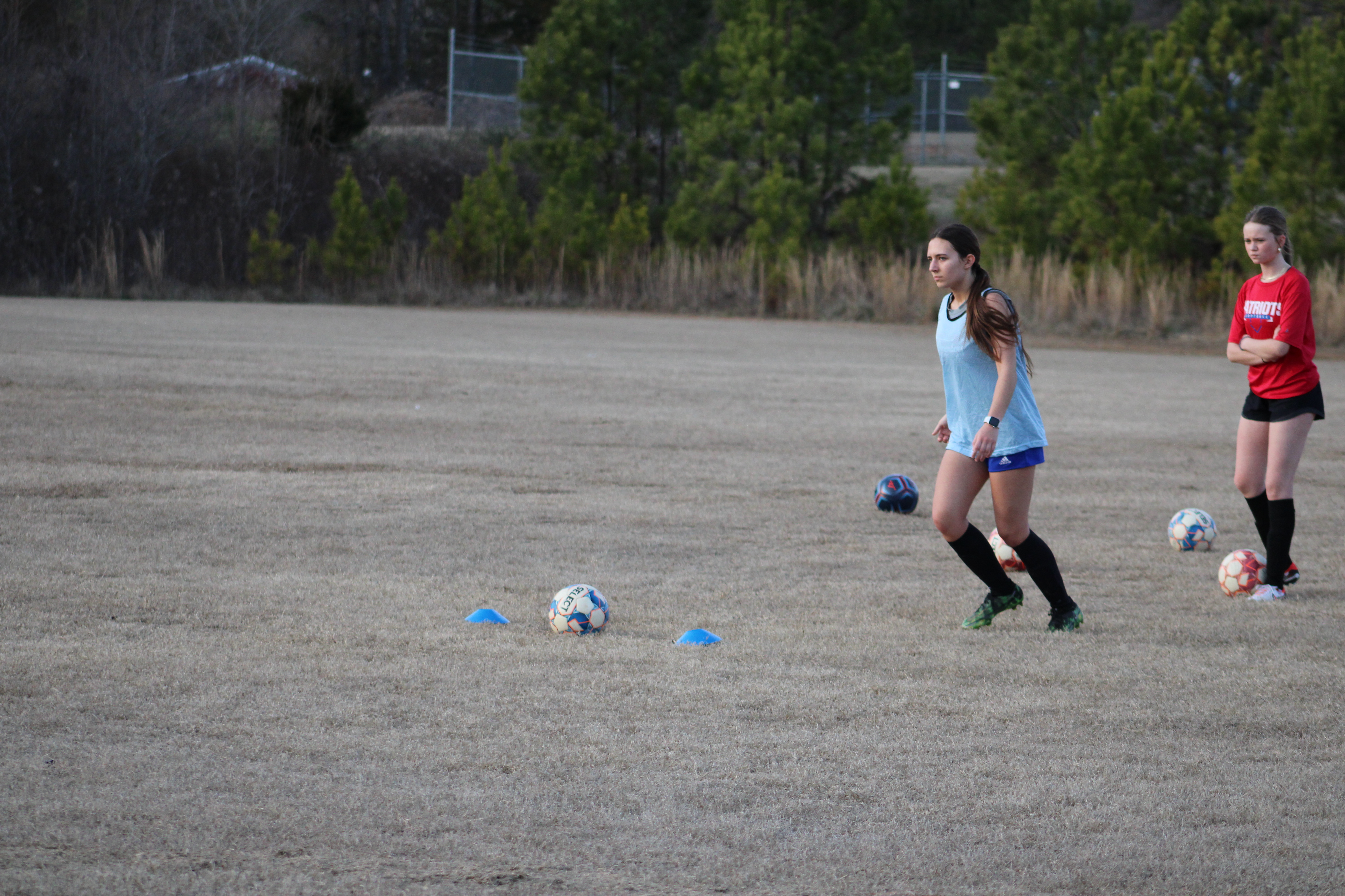 Emily Forschler lines up for a penalty kick during Oglethorpe Counties girls soccer team's practice on Thursday, Feb. 1. Forschler, alongside her sister Madeline, will be coached by their father for the first time of their high school careers. (Photo/Owen Warden)
