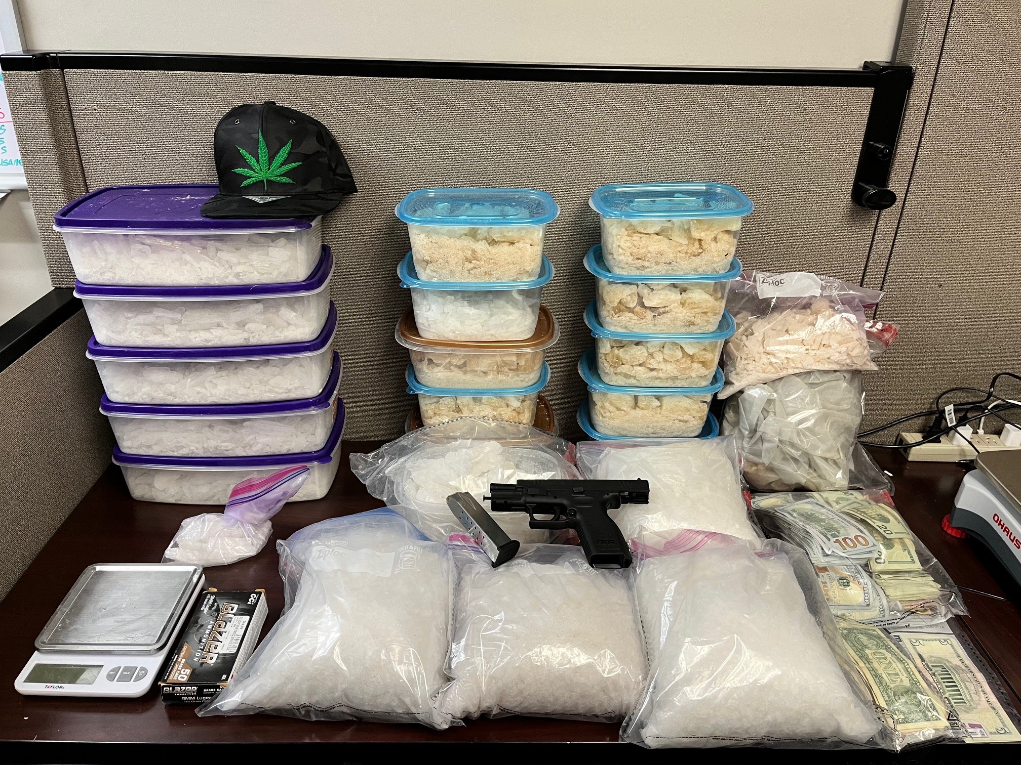 86 pounds of methamphetamine along with a Springfield 9 mm handgun and $32,000 seized. (Submitted Photo)  