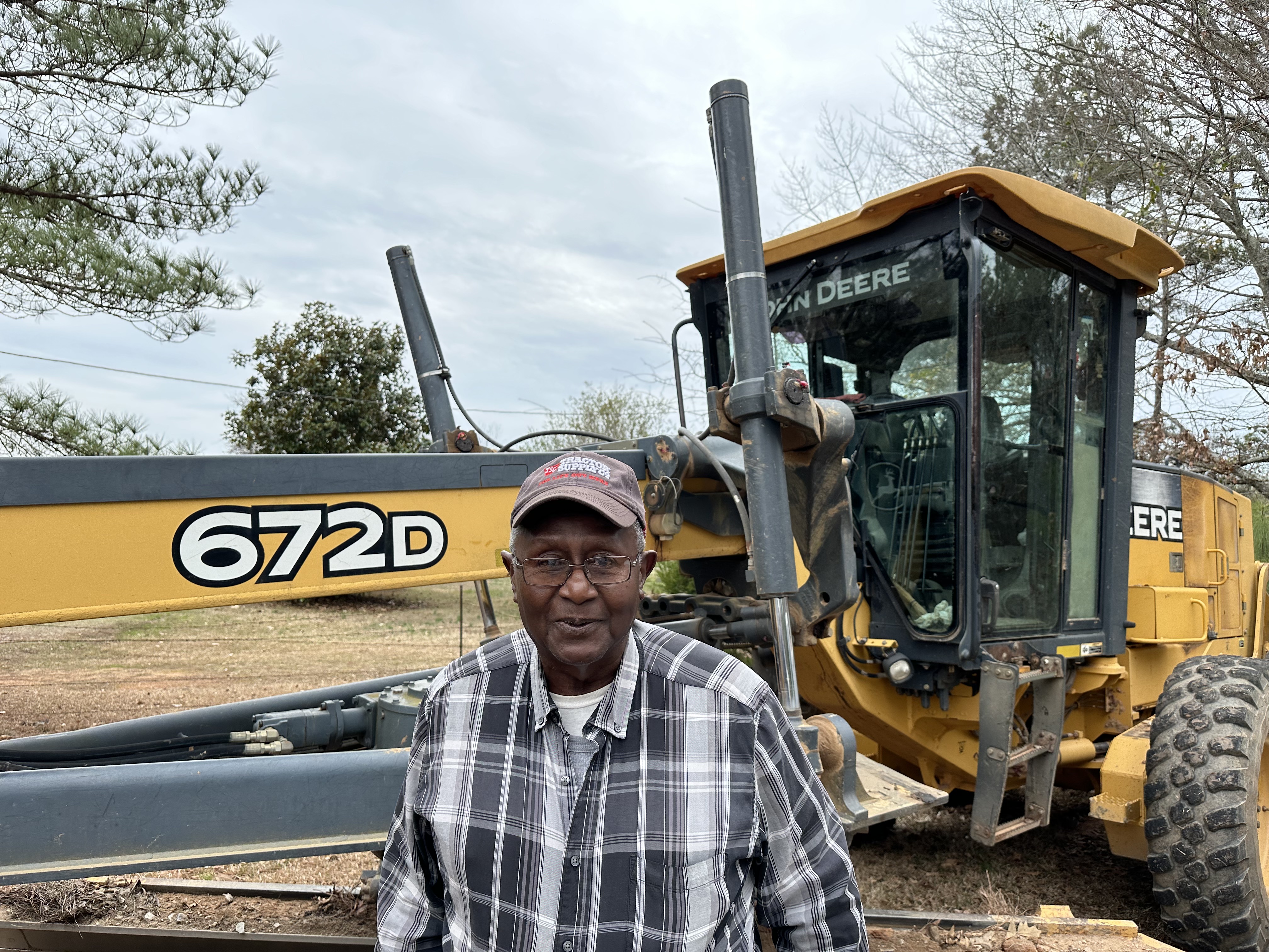 Robert Lee Turner, affectionately known as Mr. Robert by residents, spends much of his day on a road grader, scraping dirt roads throughout Oglethorpe County. Turner is technically part time, but often works full days. (Abby Peacock/The Oglethorpe Echo)