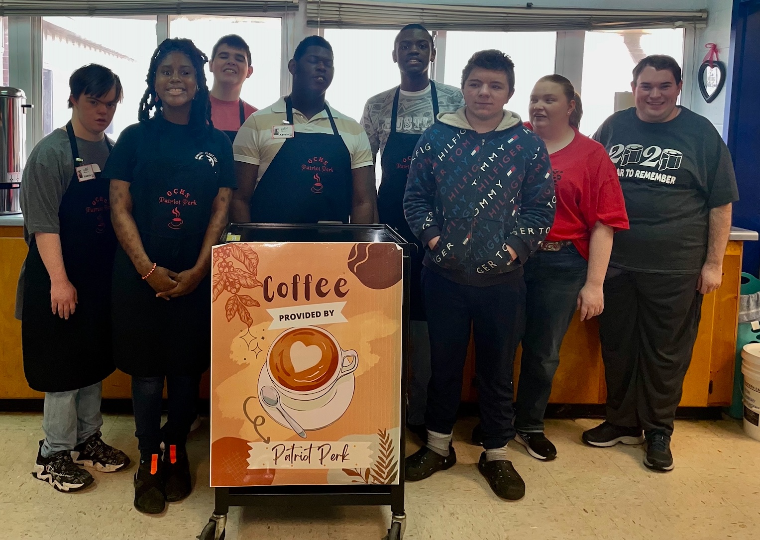 The student employees of Patriot Perk include (from left) Lucas Stanley, Kayla McCommons, Hunter Long, Xavian Smith, Khalic Hardy, Dallas Miller, Kayla Bass and Trevor Roberts. They serve coffee to the faculty and staff at Oglethorpe County High School. (Ellie Pool/Oglethorpe Echo)