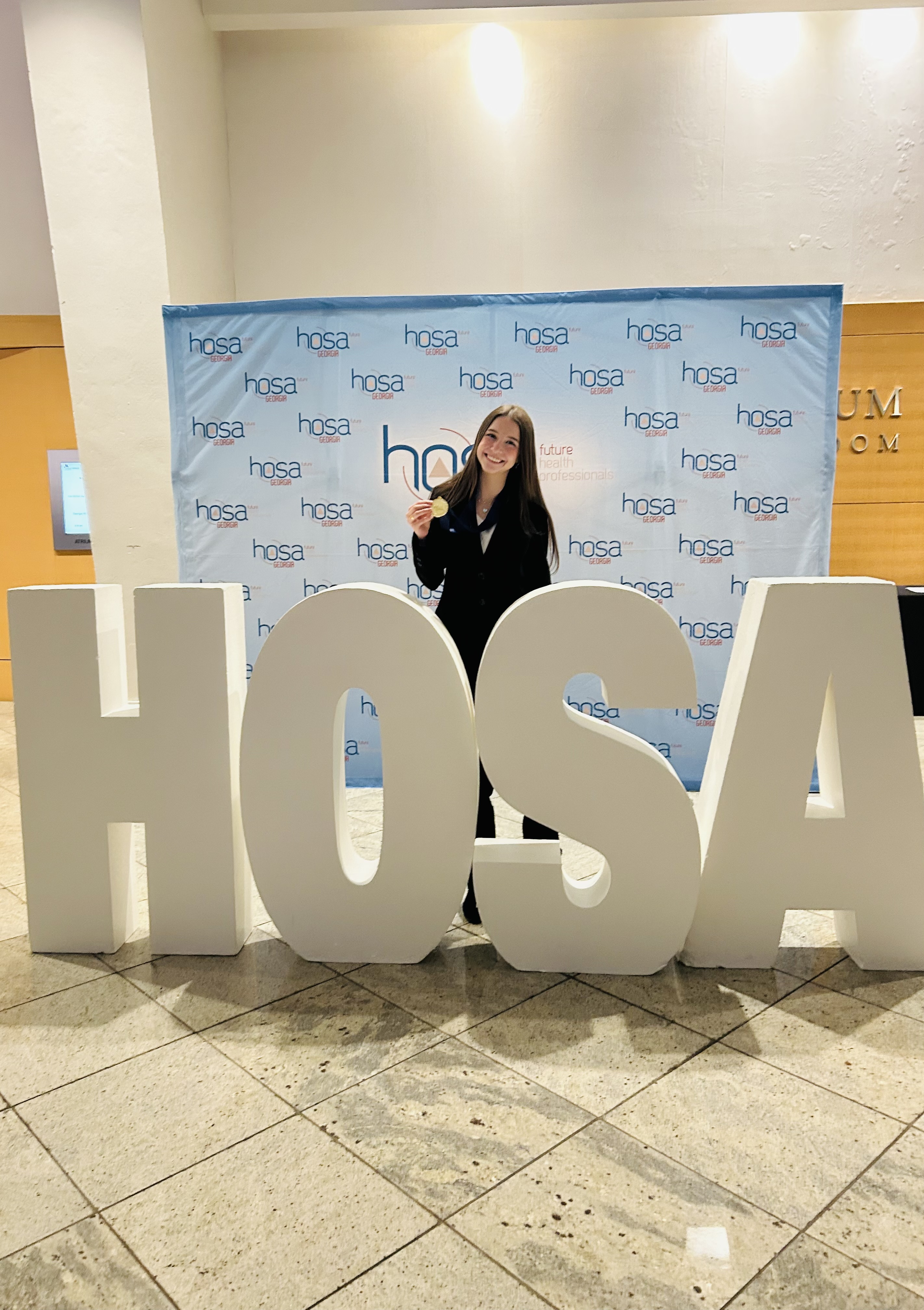 OCHS senior Ella Crowe shows off her medal after she won in nurse assisting at the HOSA Conference last month in Atlanta. She plans to attend the International Leadership Conference in Houston in June. (Submitted Photo)