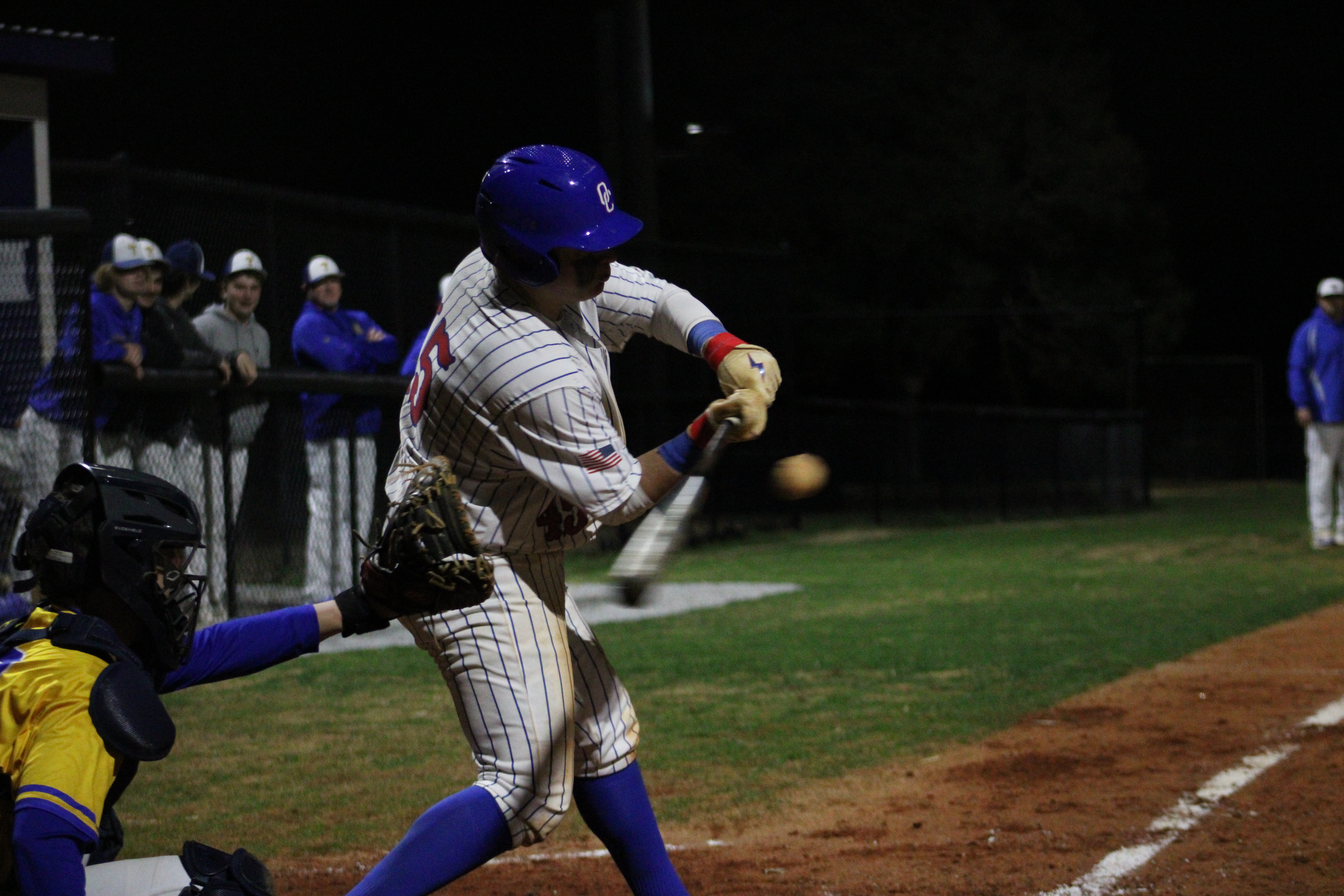 Oglethorpe County's Eli Ossick swings and is about to hit the ball against Lake Oconee Academy on Feb. 29. (Photo/Owen Warden)
