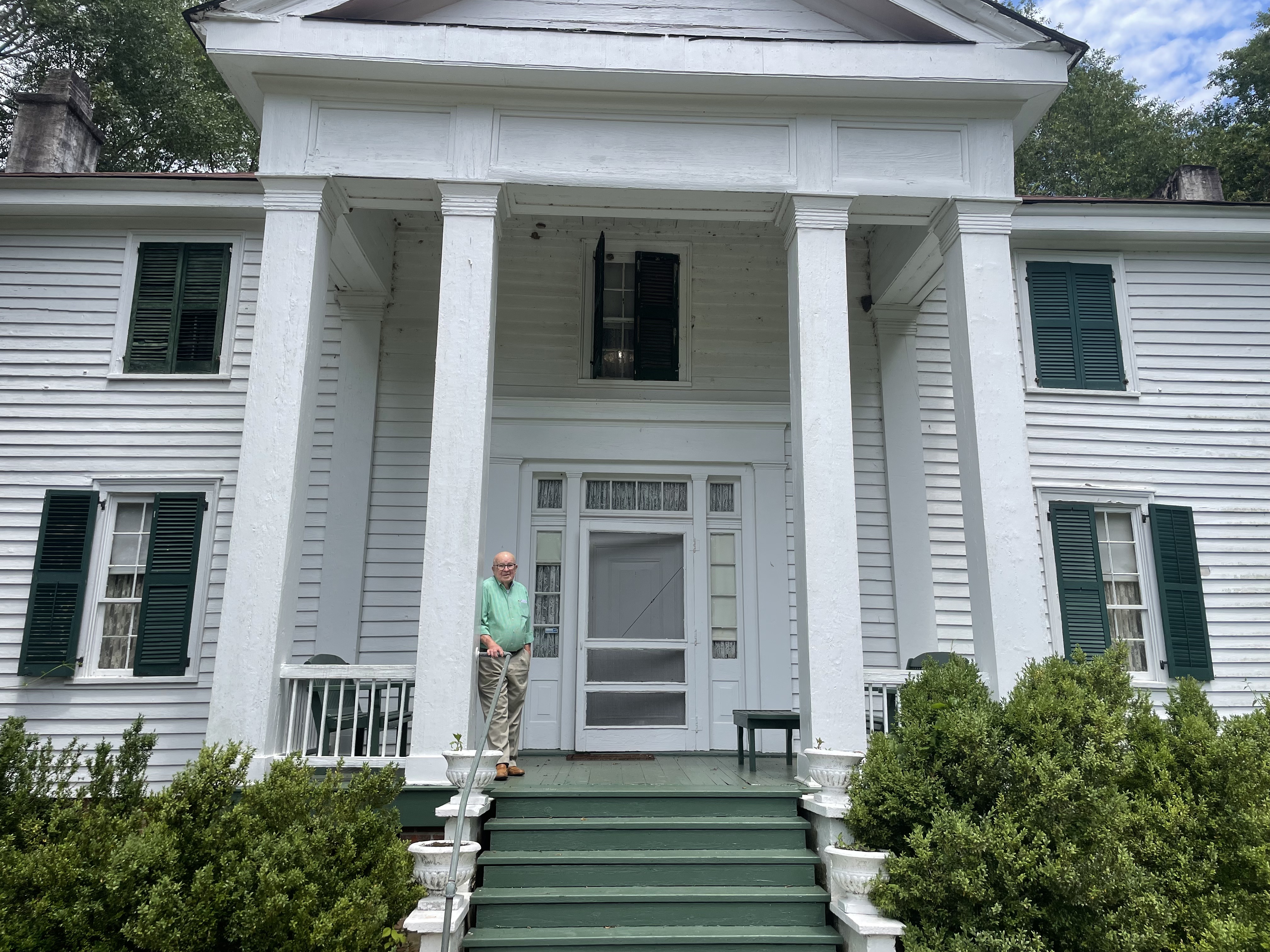 Jack Howard pictured in front of his house in Lexington, which has been owned by the Howard family since 1836. Howard was born in the house and moved back into it in 1996 following his mother's death. (Jack Keys/The Oglethorpe Echo)