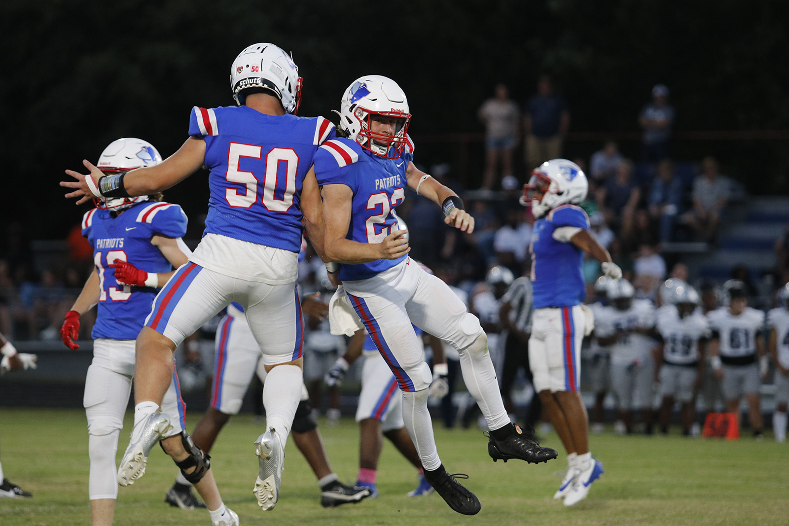 Tanner Mckie (50) and Matthew Martin (23) celebrate after recovering a fumble during Oglethorpe County’s homecoming game against Elbert County on Sept. 20, 2024. Martin also had four tackles and forced the fumble. (Photo/ McCain Bracewell)
